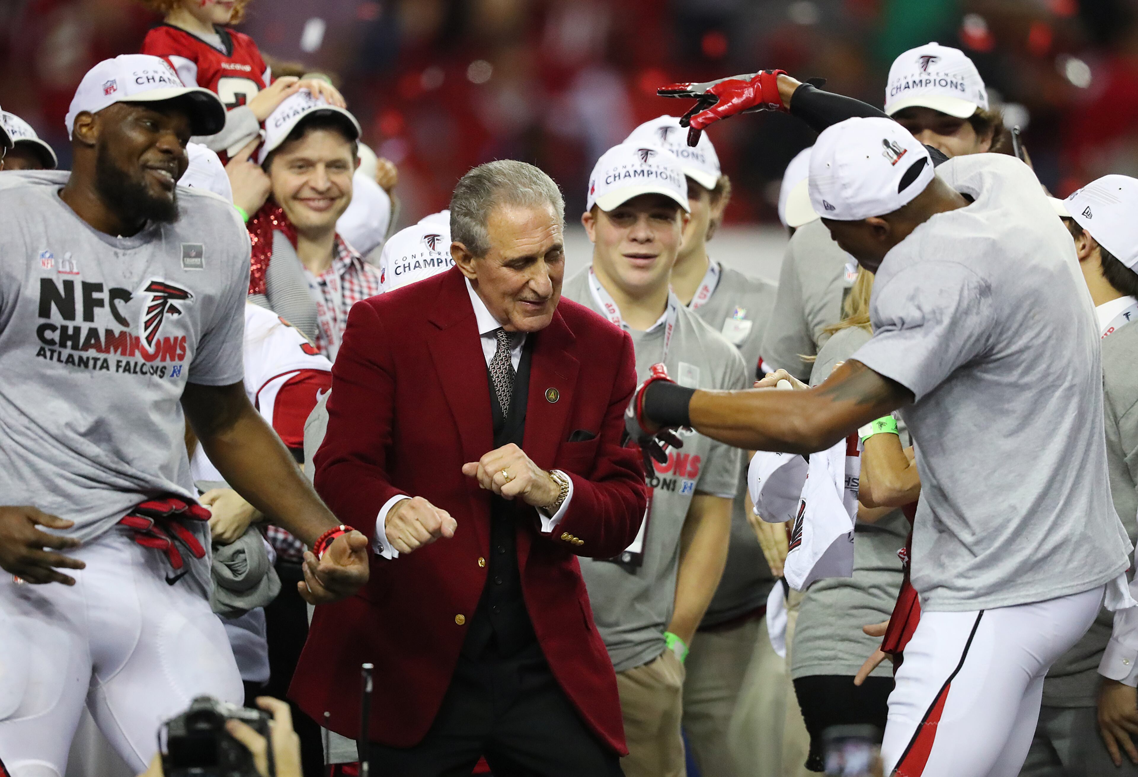 January 22, 2017, Atlanta: Falcons owner Arthur Blank dances on stage with his players after beating the Packers 44-21 in the NFL football NFC Championship game on Sunday, Jan. 22, 2017, in Atlanta. Curtis Compton/ccompton@ajc.com