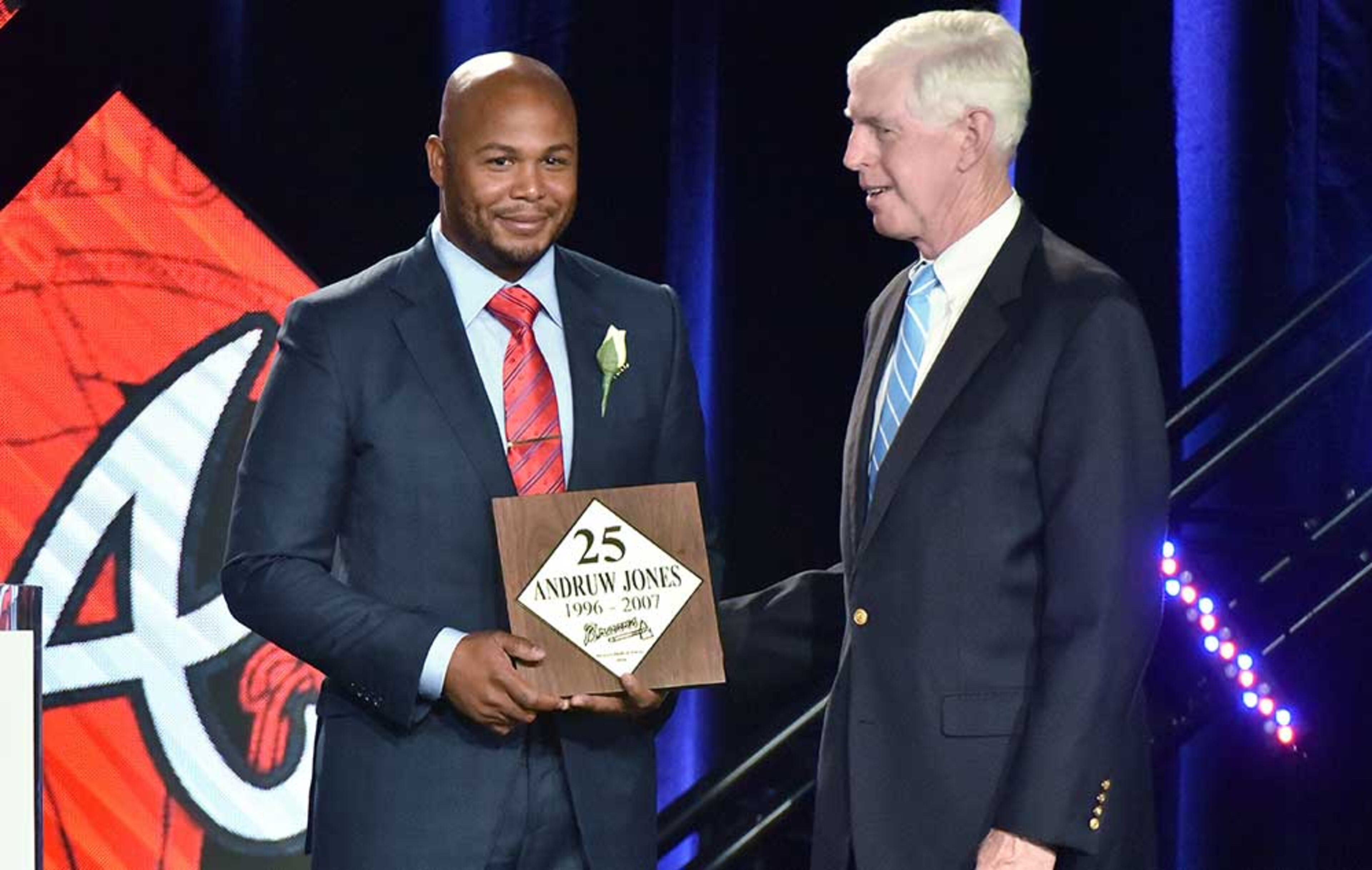 Atlanta Braves Chairman and CEO Terry McGuirk (right) presents a special plaque to former Atlanta Braves outfielder Andruw Jones during Braves Hall of Fame luncheon at Hyatt Regency on Friday, August 19, 2016. Atlanta Braves President John Schuerholz and former outfielder Andruw Jones were inducted into the Braves Hall of Fame. The duo were inducted during a luncheon and honored that evening in a pregame ceremony before the Braves play the Washington Nationals.