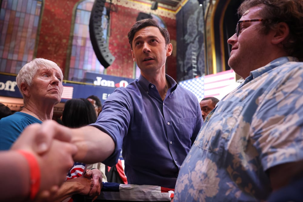 U.S. Sen. Jon Ossoff shakes hands with a supporter after a joint campaign rally with Democratic candidate for governor Keisha Lance Bottoms at the Tabernacle in Atlanta on Sunday. (Arvin Temkar/AJC)