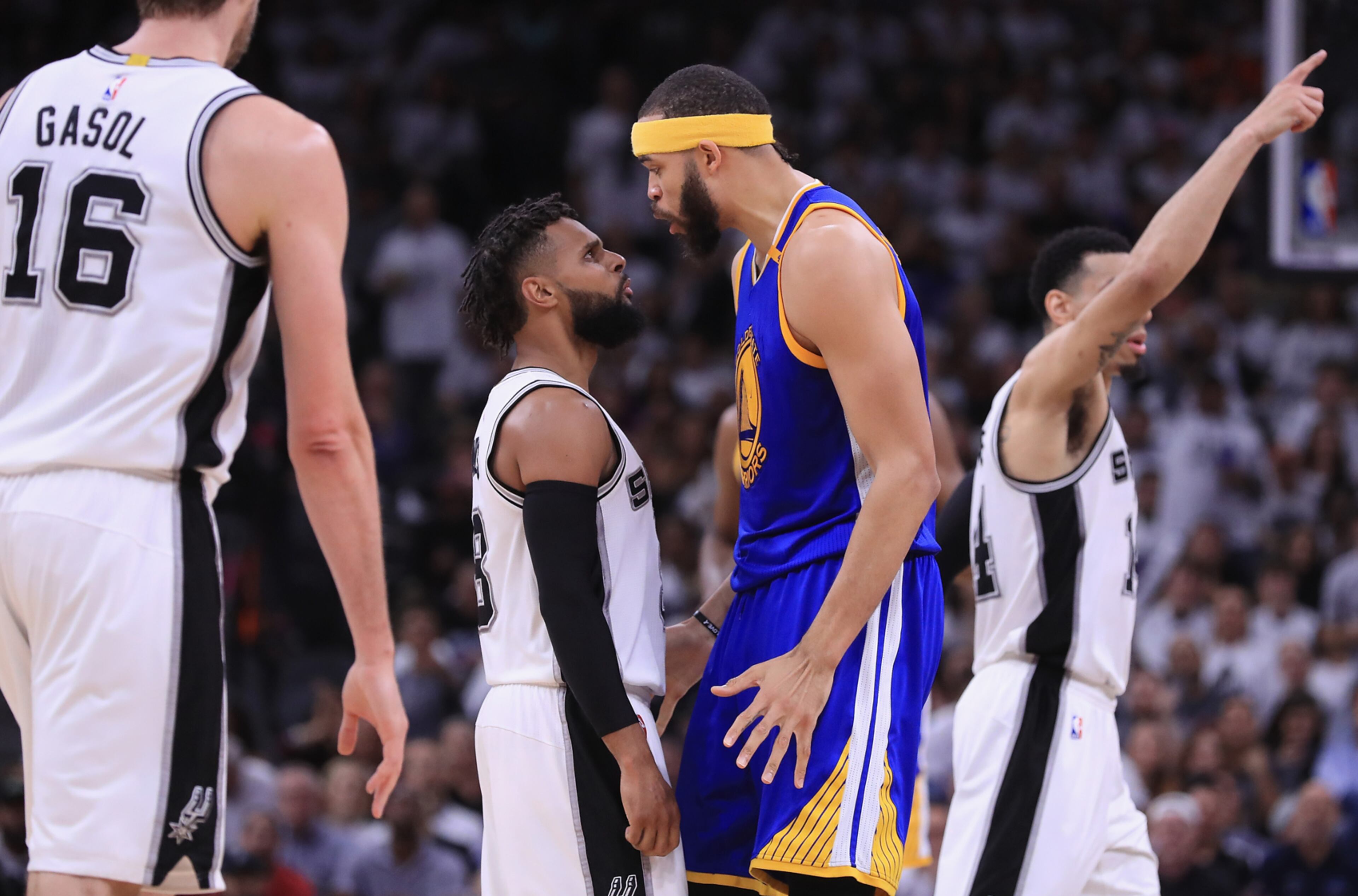 SAN ANTONIO, TX - MAY 20: JaVale McGee #1 of the Golden State Warriors exchanges words with Patty Mills #8 of the San Antonio Spurs in the first half during Game Three of the 2017 NBA Western Conference Finals at AT&T Center on May 20, 2017 in San Antonio, Texas. (Photo by Ronald Martinez/Getty Images)