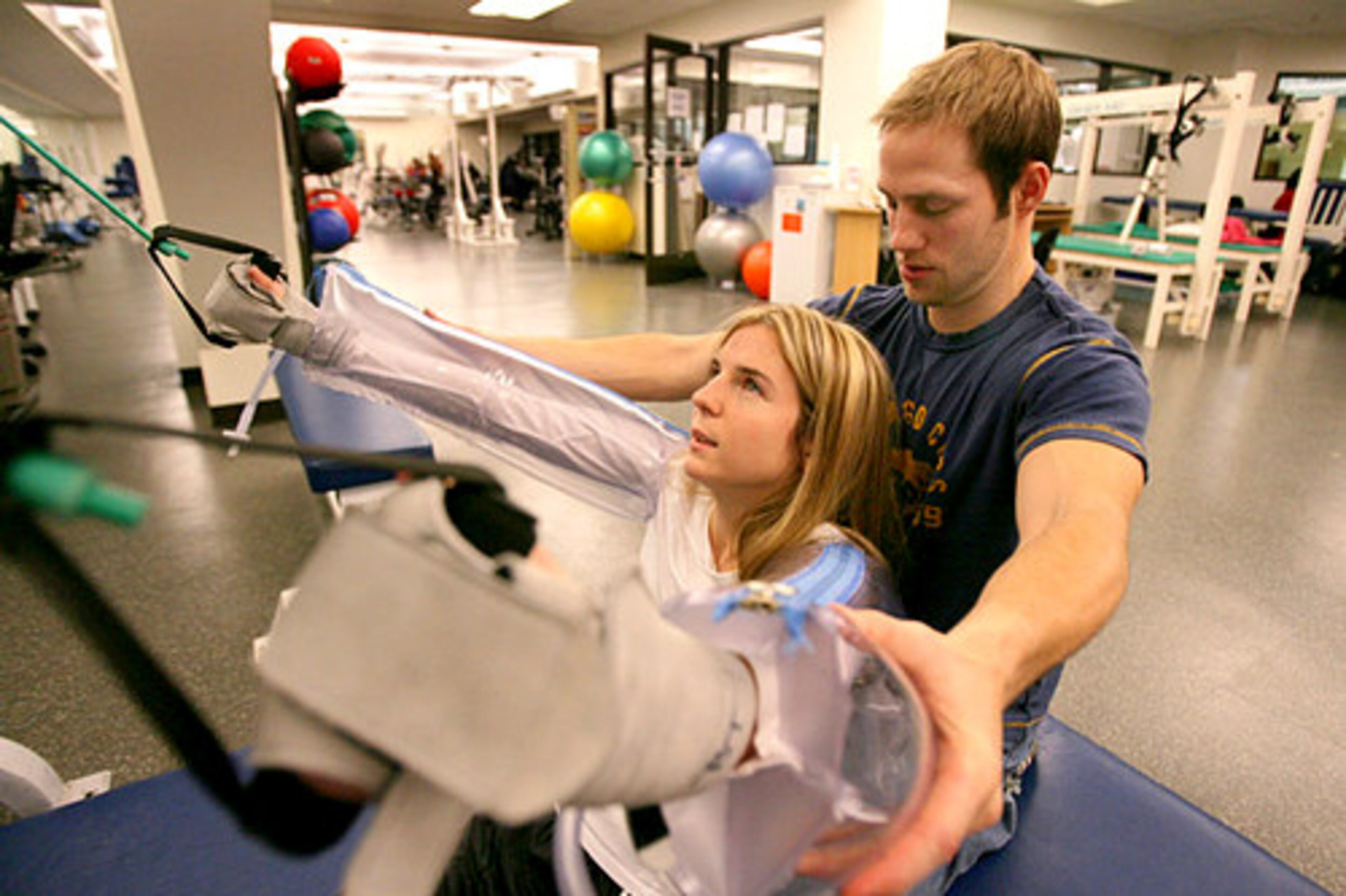 Cindy Donald, who was left a quadriplegic in an accident, hasn't let her condition crush her spirit. Here, she works with Josh Zottnick during therapy at the Shepherd Center in Atlanta.