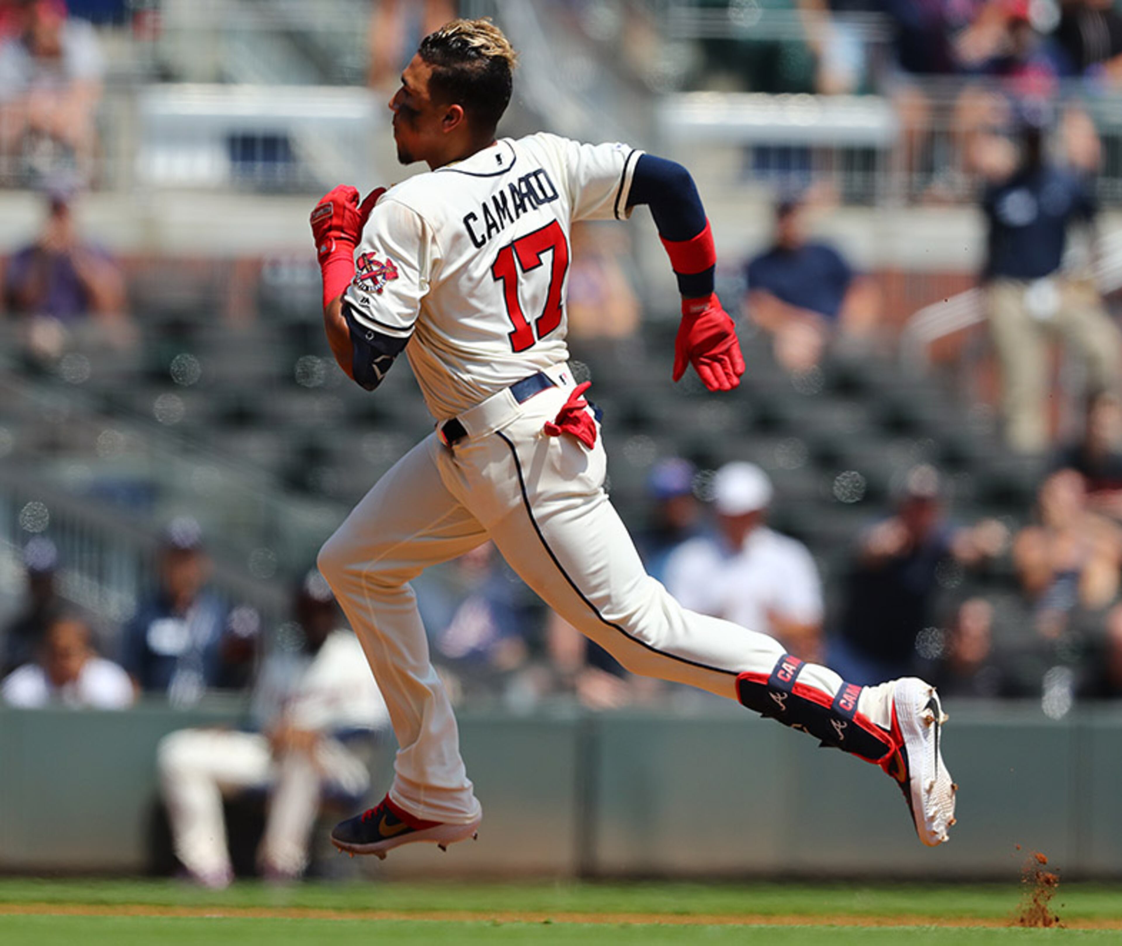 Braves' Johan Camargo heads to third base for a triple against the Colorado Rockies during the fourth inning Sunday, April 28, 2019, at SunTrust Park in Atlanta.