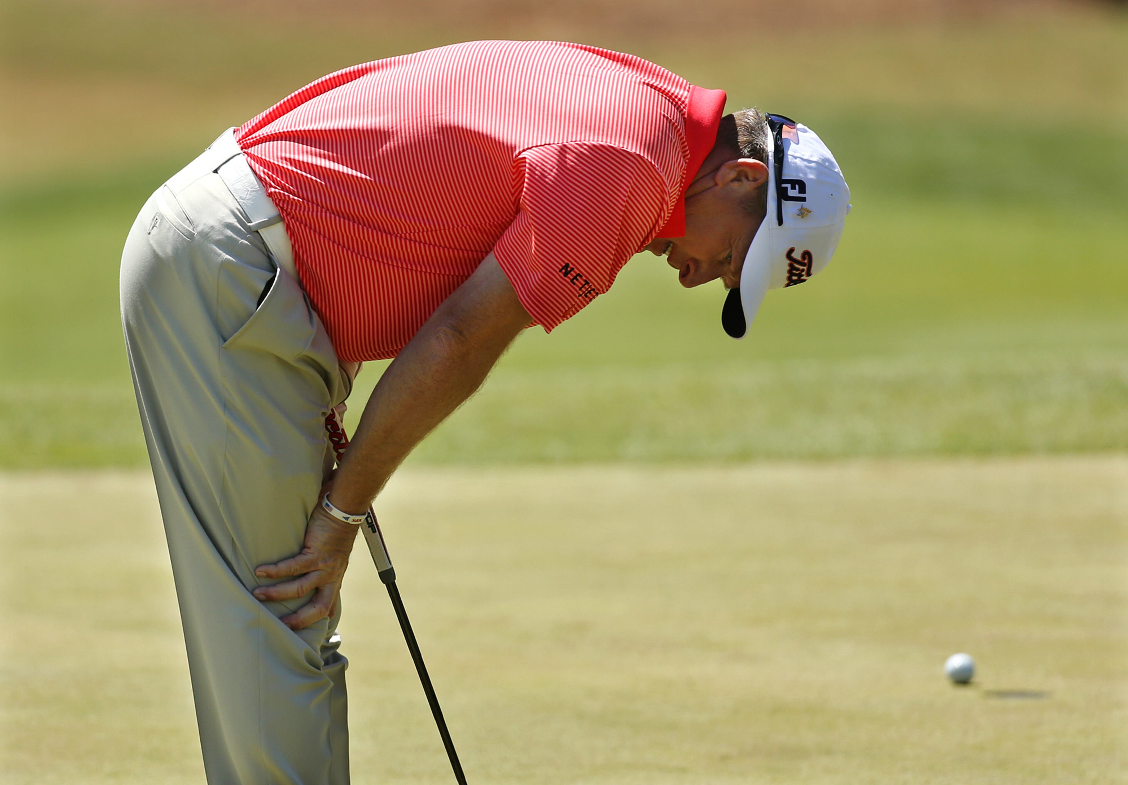Woody Austin reacts to just missing his birdie putt on the first hole. Curtis Compton / ccompton@ajc.com