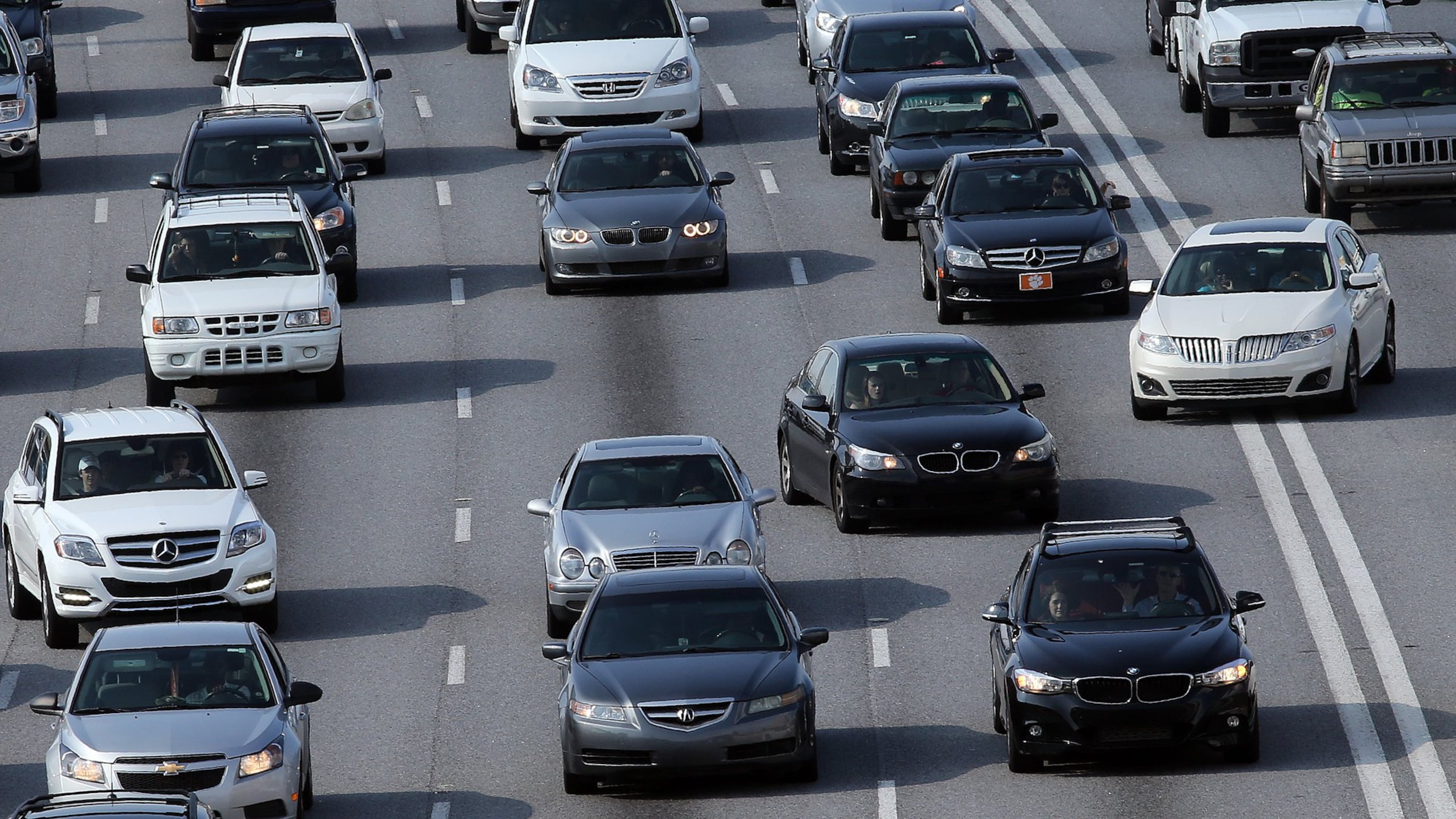 There are blinkers on cars for a reason. Drivers jockey for position on the Downtown Connector on Tuesday August 12, 2014. BEN GRAY / BGRAY@AJC.COM