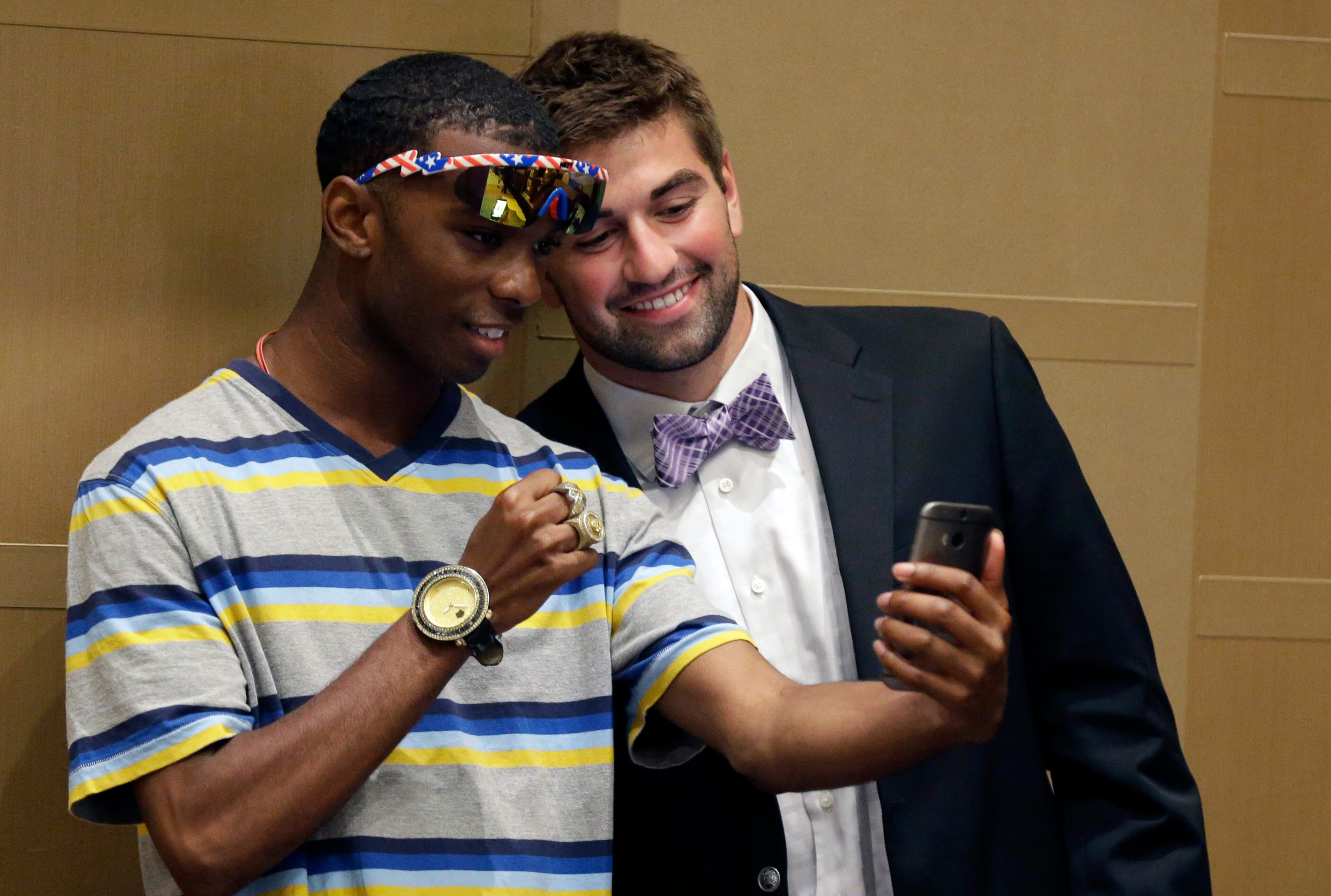 Kansas State quarterback Jack Waters, right, poses for a cell phone photo with Michael Scott, Jr., during the NCAA college Big 12 Conference football media days in Dallas, Tuesday, July 22, 2014. (AP Photo)