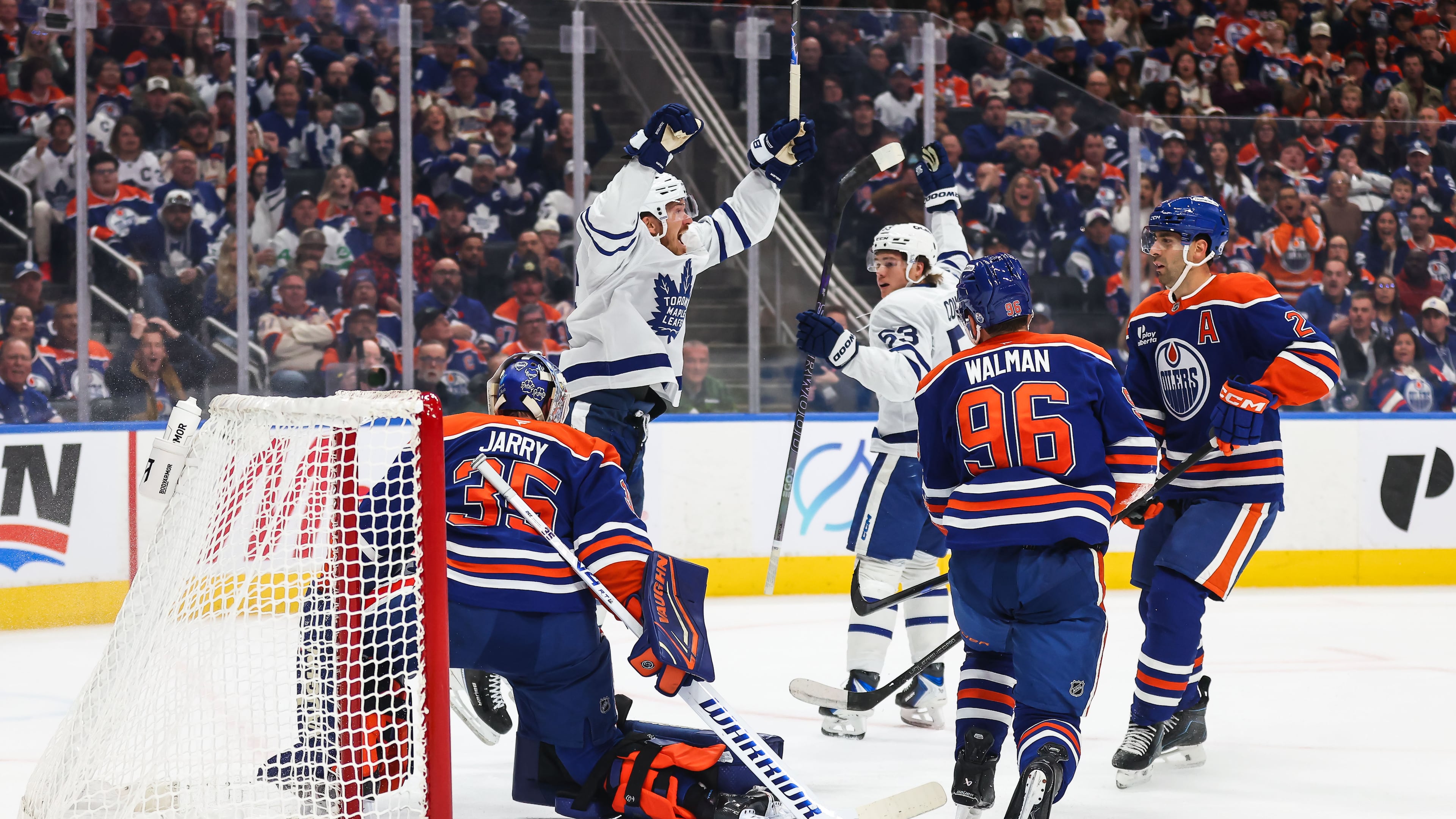 Toronto Maple Leafs' Jack Roslovic, back left, and Easton Cowan (53) celebrate after Roslovic's goal against the Edmonton Oilers during the first period of an NHL hockey game in Edmonton, Alberta, Saturday, Oct. 24, 2026. (Codie McLachlan/The Canadian Press via AP)