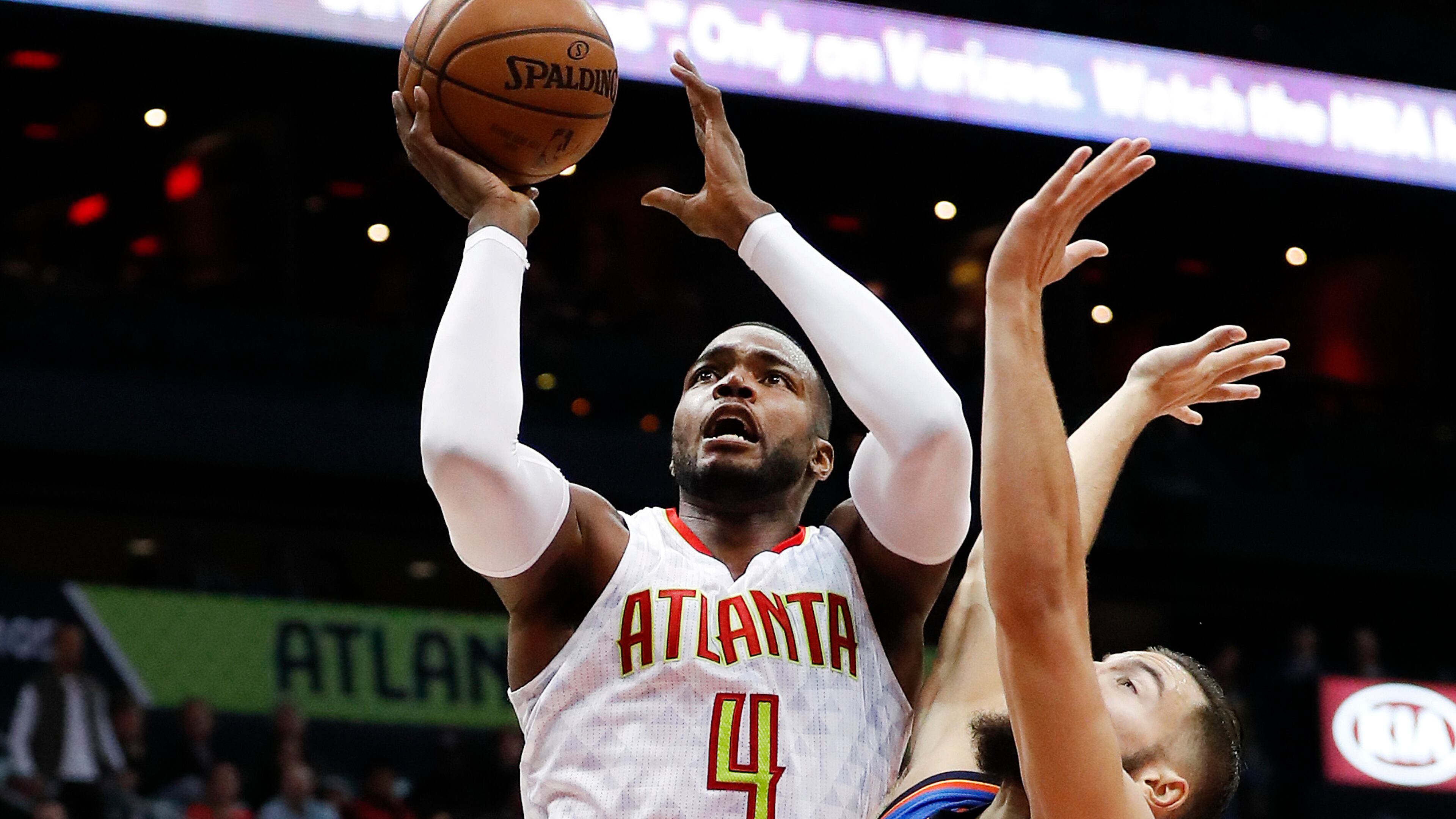 Atlanta Hawks forward Paul Millsap (4) goes up for a shot against Oklahoma City Thunder center Joffrey Lauvergne (77) in the first half of an NBA basketball game Monday, Dec. 5, 2016, in Atlanta. (AP Photo/John Bazemore)