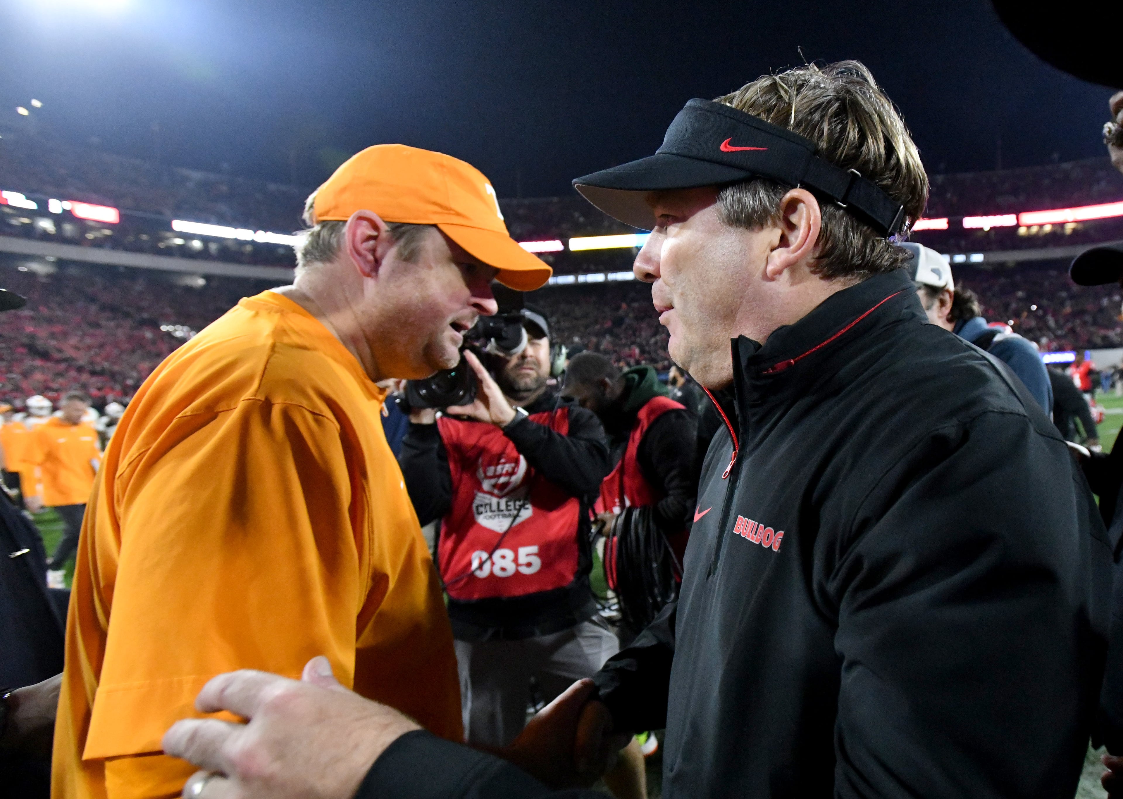 Tennessee head coach Josh Heupel (left) and Georgia head coach Kirby Smart shake hands after Georgia beat Tennessee 31-17 at Sanford Stadium on Saturday, Nov. 16, 2024, in Athens. (Hyosub Shin/AJC)