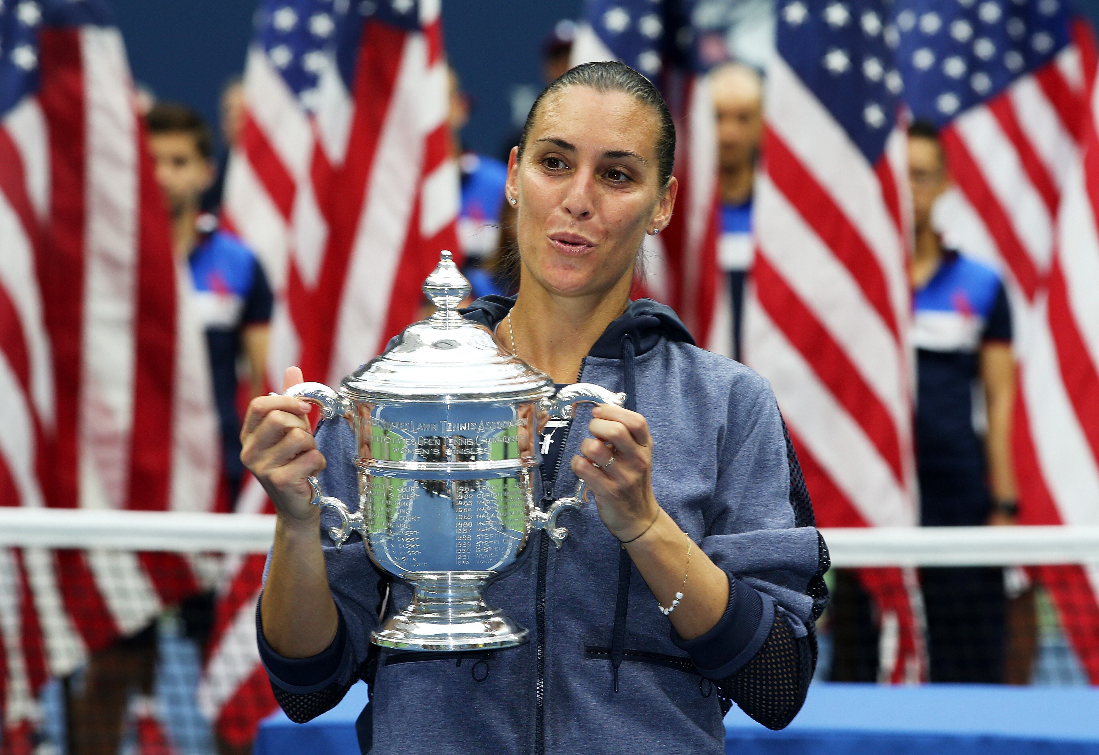 NEW YORK, NY - SEPTEMBER 12: Flavia Pennetta of Italy celebrates with the winner's trophy after defeating Roberta Vinci of Italy during their Women's Singles Final match on Day Thirteen of the 2015 US Open at the USTA Billie Jean King National Tennis Center on September 12, 2015 in the Flushing neighborhood of the Queens borough of New York City. Pennetta defeated Vinci 7-6, 6-2. (Photo by Matthew Stockman/Getty Images)