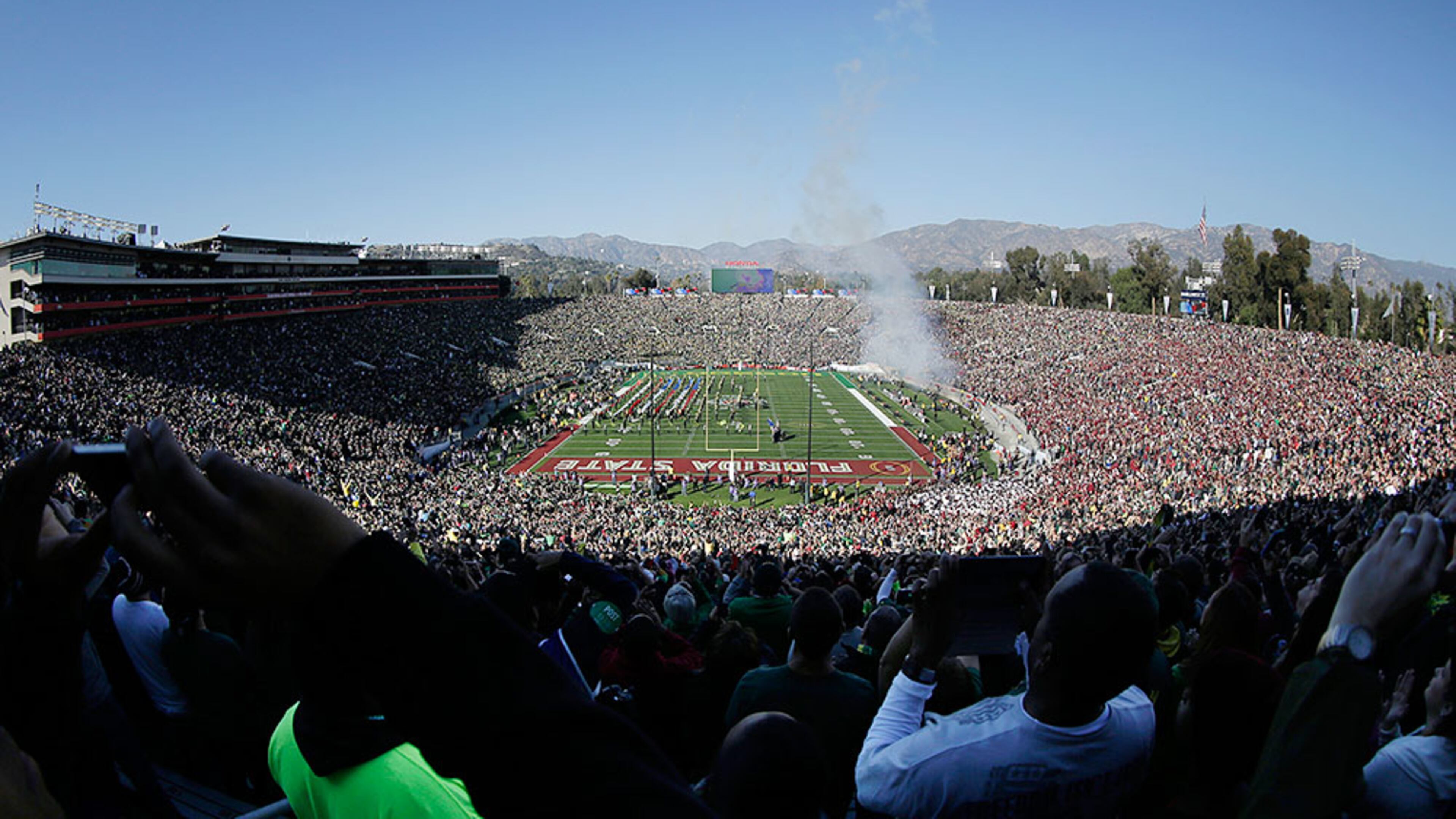 In this photo taken with a fisheye lens, a U.S. Air Force B-2 stealth bomber does a flyover before the Rose Bowl NCAA college football playoff semifinal between Oregon and Florida State, Thursday, Jan. 1, 2015, in Pasadena, Calif. (AP Photo/Richard Vogel)