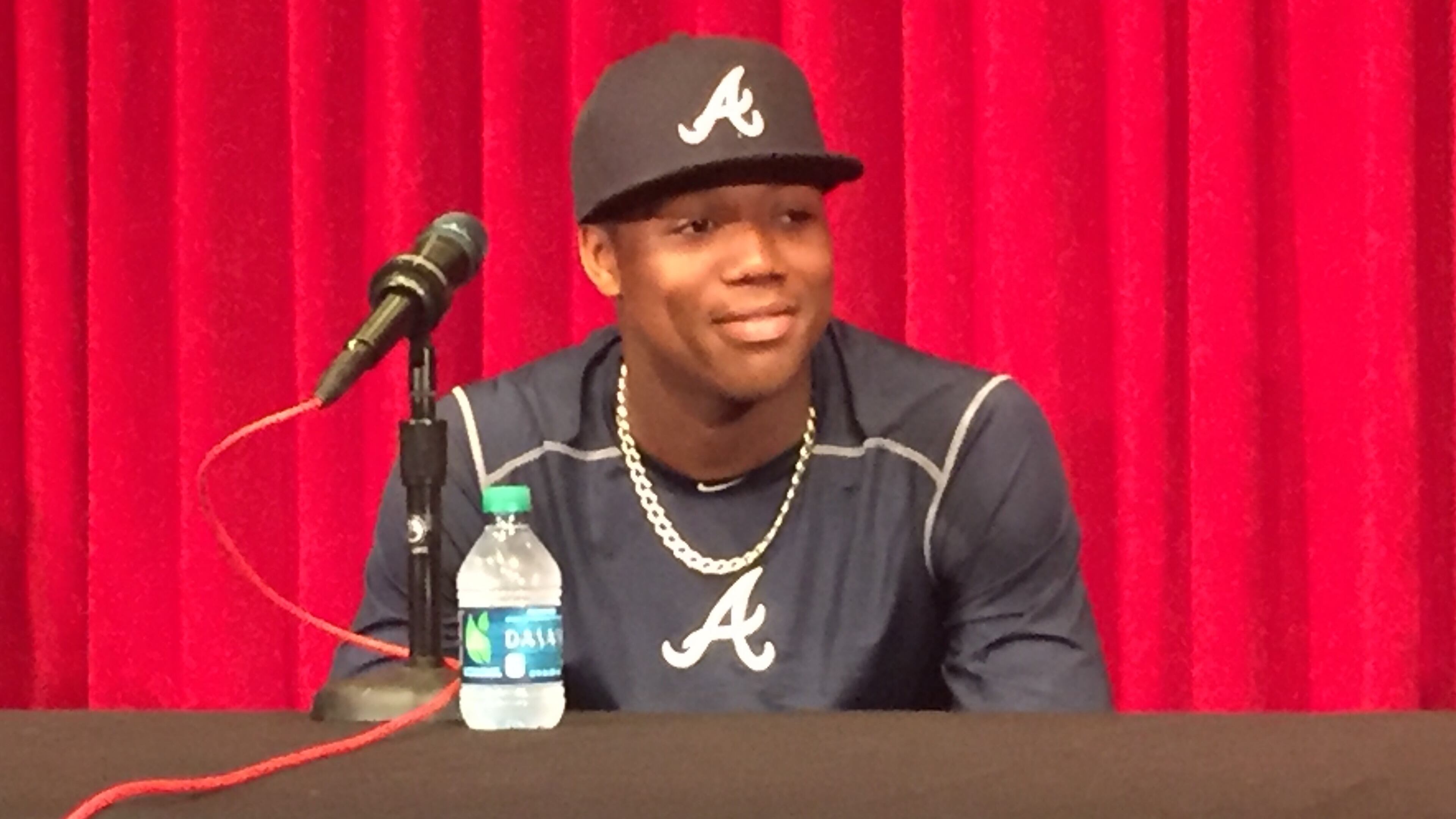 Ronald Acuna meets with the media before his major league debut on April 25 at Great American Ball Park in Cincinnati. (Gabe Burns / AJC)