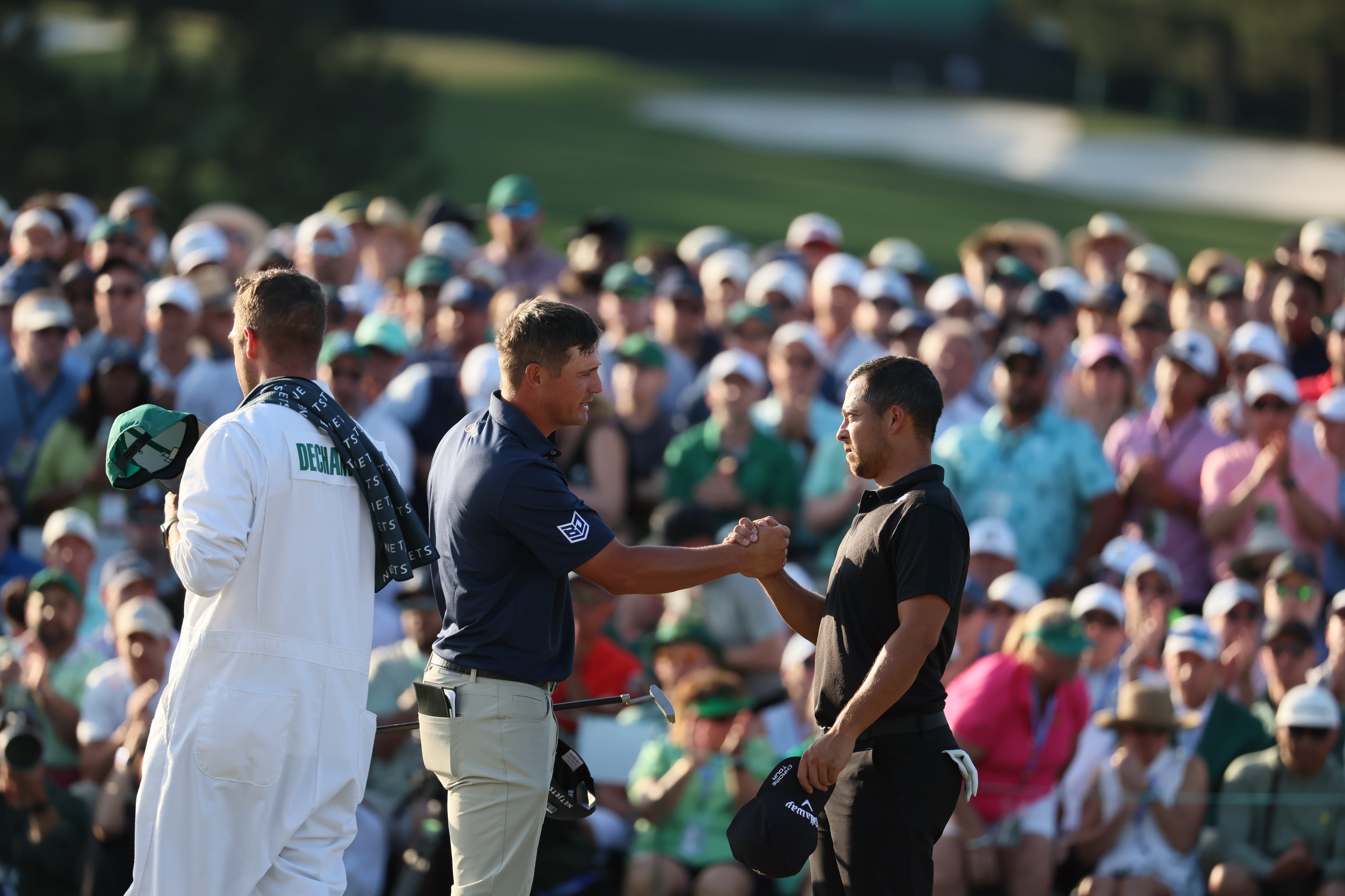 Bryson DeChambeau and Xander Schauffele finish their final round of the 2024 Masters Tournament at Augusta National Golf Club, Sunday, April 14, 2024, in Augusta, Ga. Jason Getz / Jason.Getz@ajc.com)