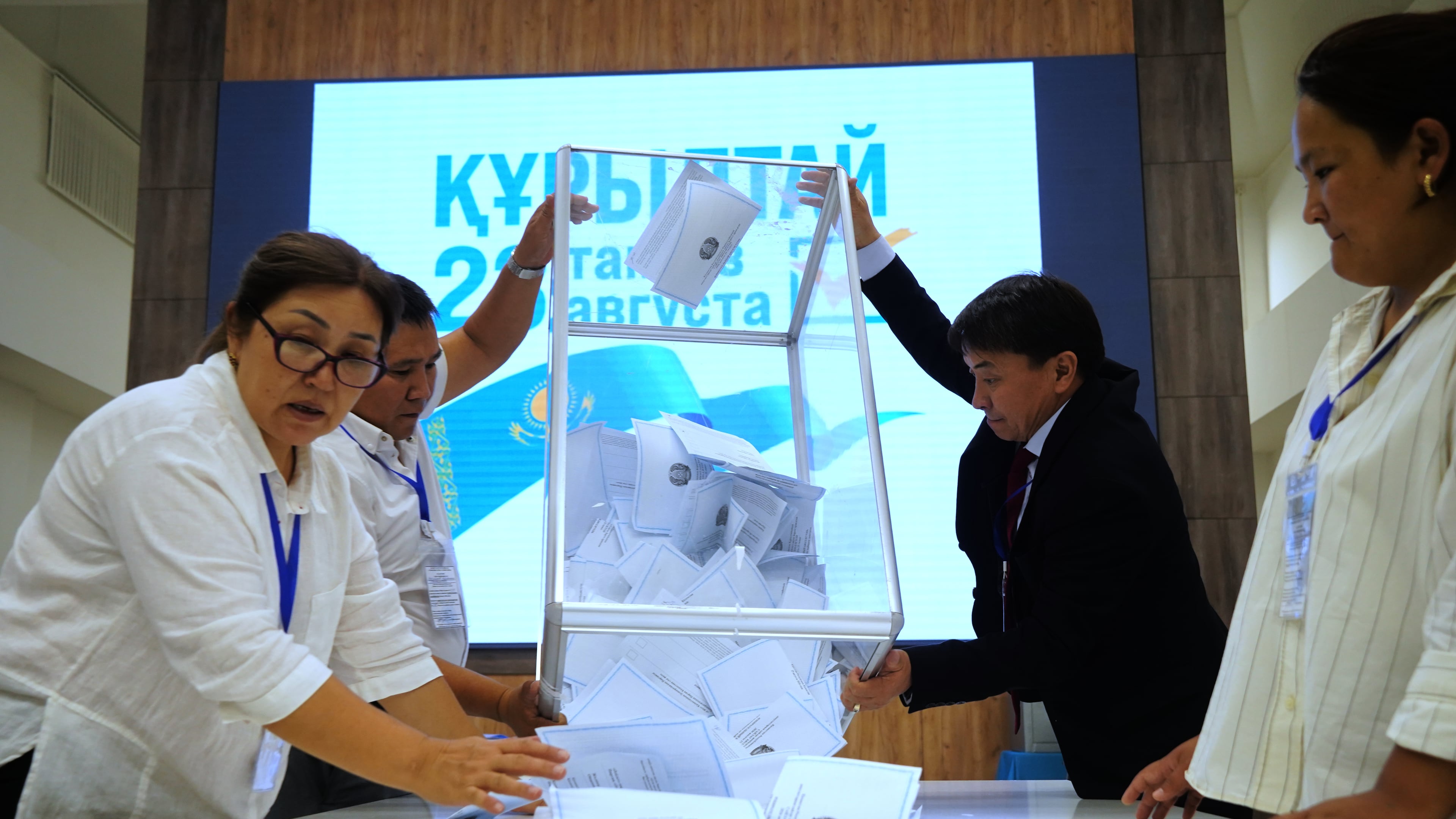 Election commission members count ballots at a polling station during early parliamentary elections in Almaty, Kazakhstan, Sunday, Aug. 23, 2026. (AP Photo/Vladimir Tretyakov)