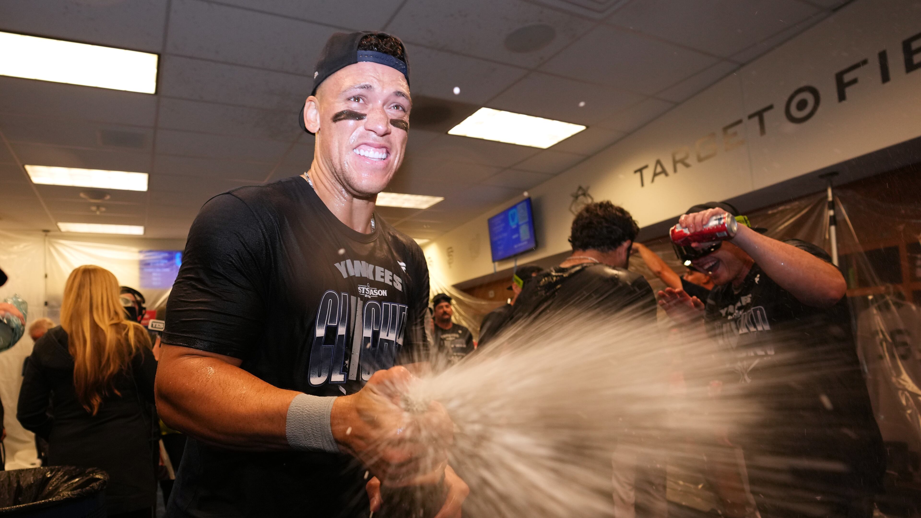 New York Yankees' Aaron Judge celebrates with teammates after they clinched the playoffs in a baseball game against the Minnesota Twins, Monday, Sept. 14, 2026, in Minneapolis. (AP Photo/Abbie Parr)