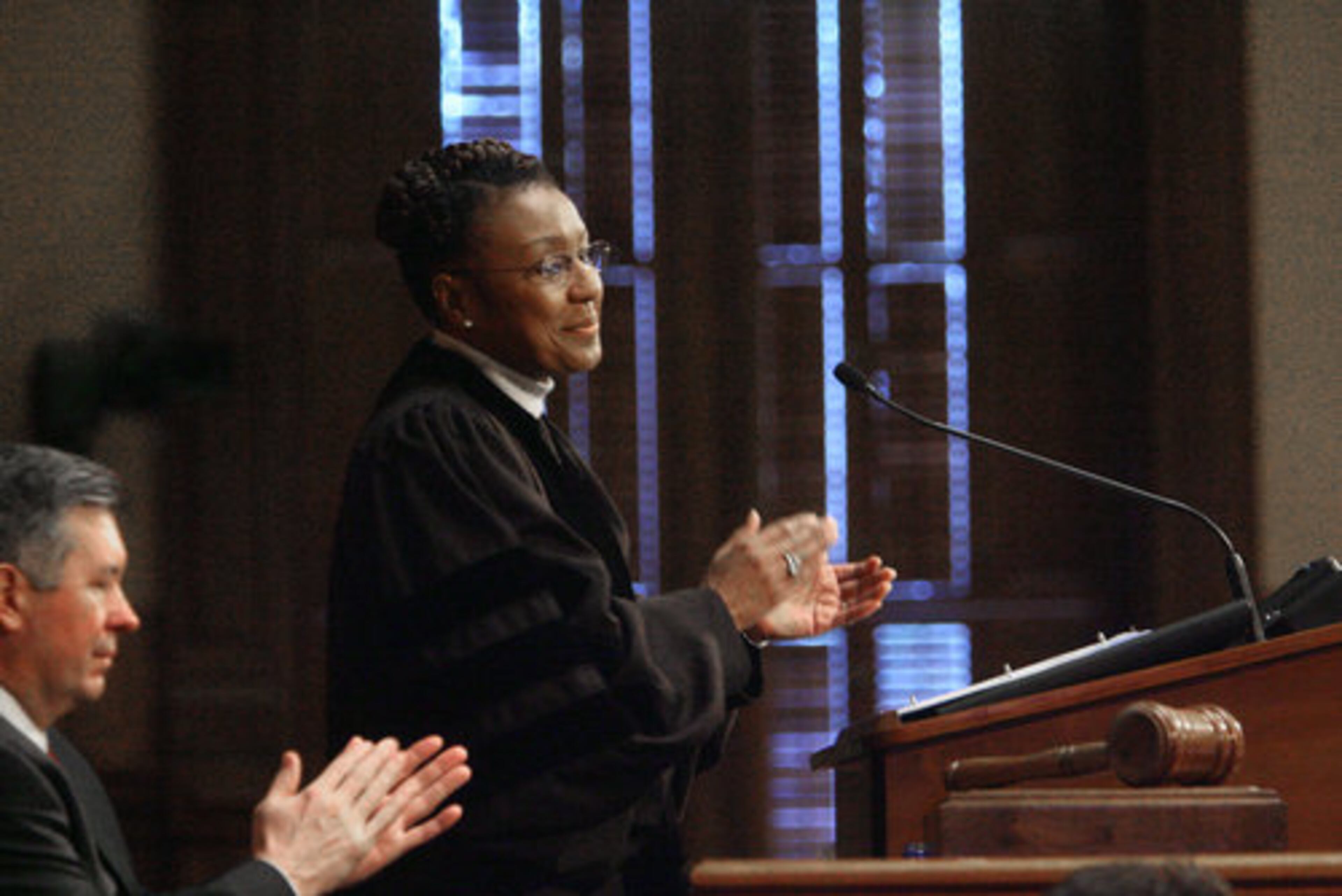 Chief Justice Leah Ward Sears applauds as she introduces her family.