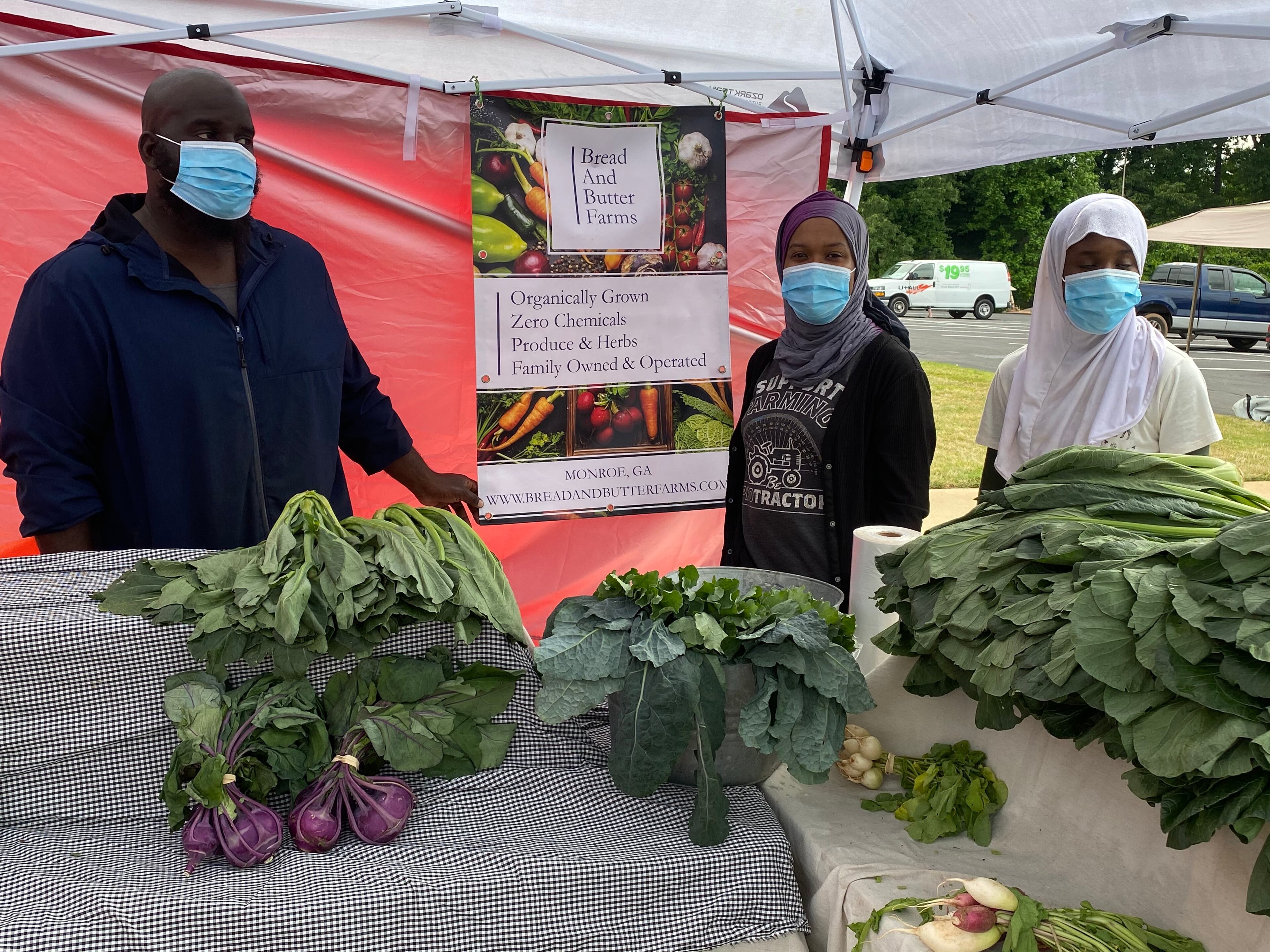 Musa (left) and Micole Hasan (center) of Bread and Butter Farms in Monroe are among the vendors at this year's Candler Black Market. Ligaya Figueras/ligaya.figueras@ajc.com
