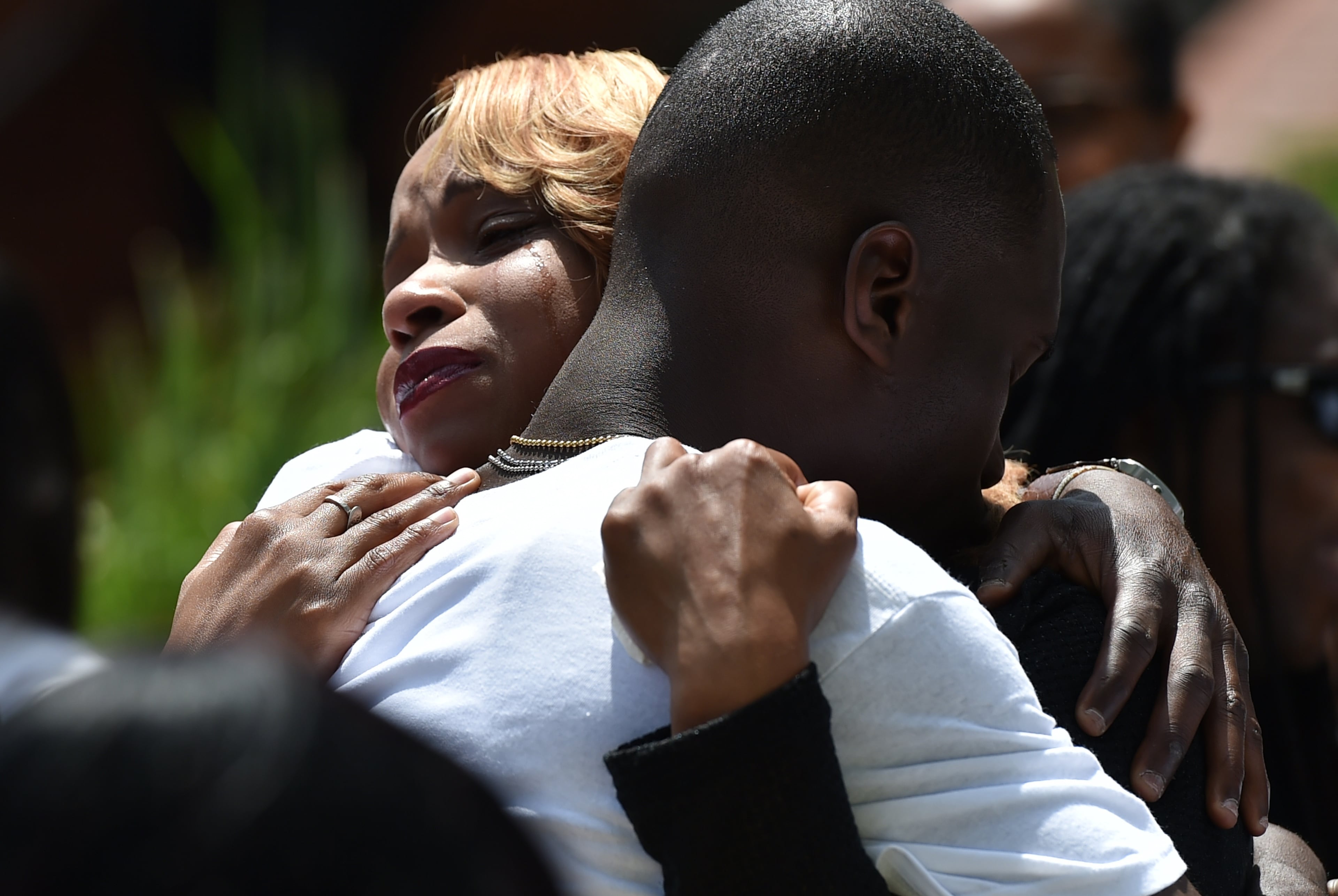 Michelle Ward is embraced by a well wisher after the casket of her 9 year-old son, Isaiah, was loaded into a horse drawn carriage at his funeral. Isaiah was killed after being struck by an automobile while walking in his Northwest Atlanta neighborhood on April 15, 2016. His brother and friend were injured in the crash. The alleged driver -- Ryan Lisabeth -- has been charged with DUI on heroin and has an extensive criminal record. BRANT SANDERLIN/BSANDERLIN@AJC.COM
