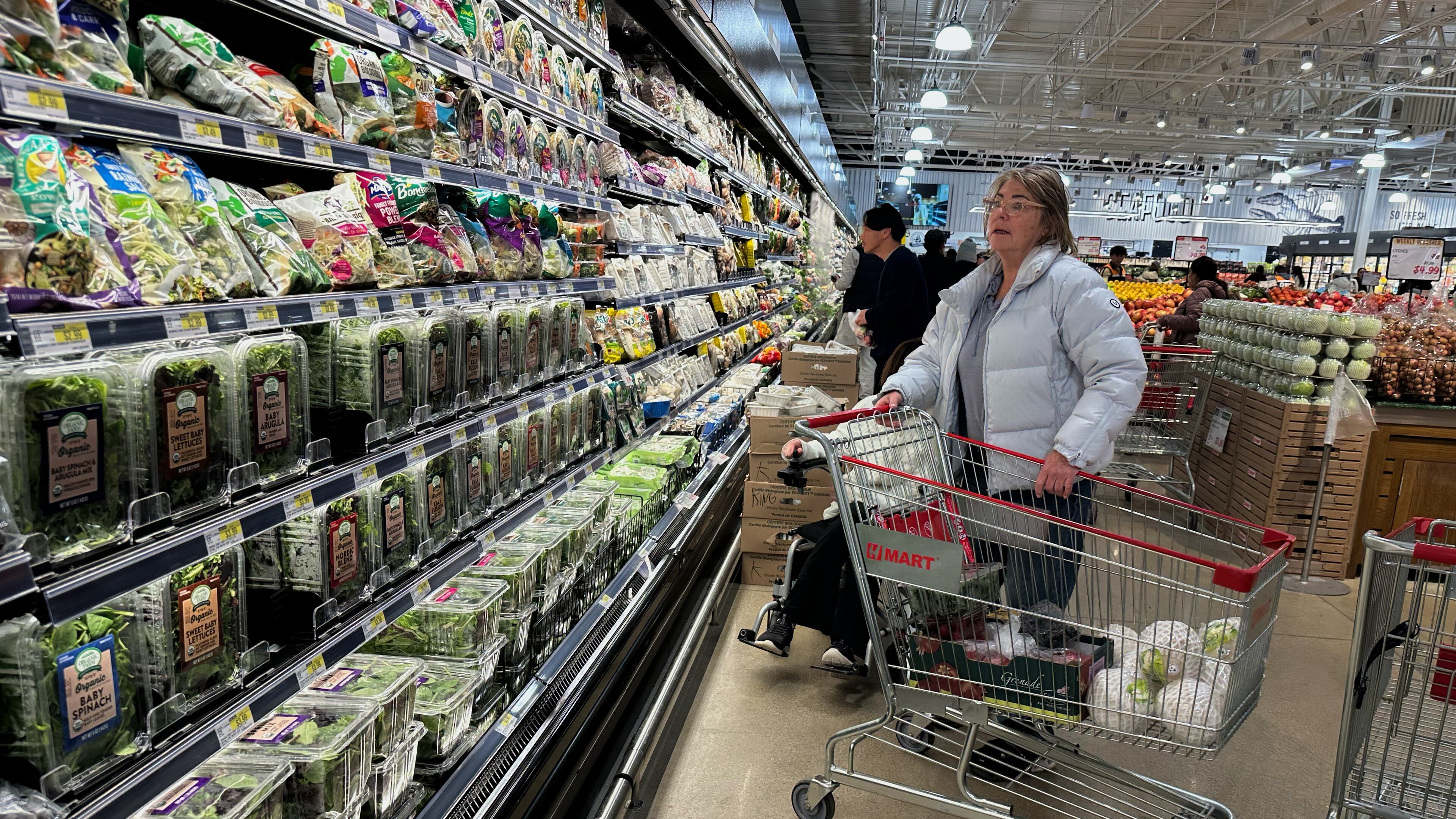Shoppers shop at a grocery store in Schaumburg, Ill., Monday, Feb. 9, 2026. (AP Photo/Nam Y. Huh)