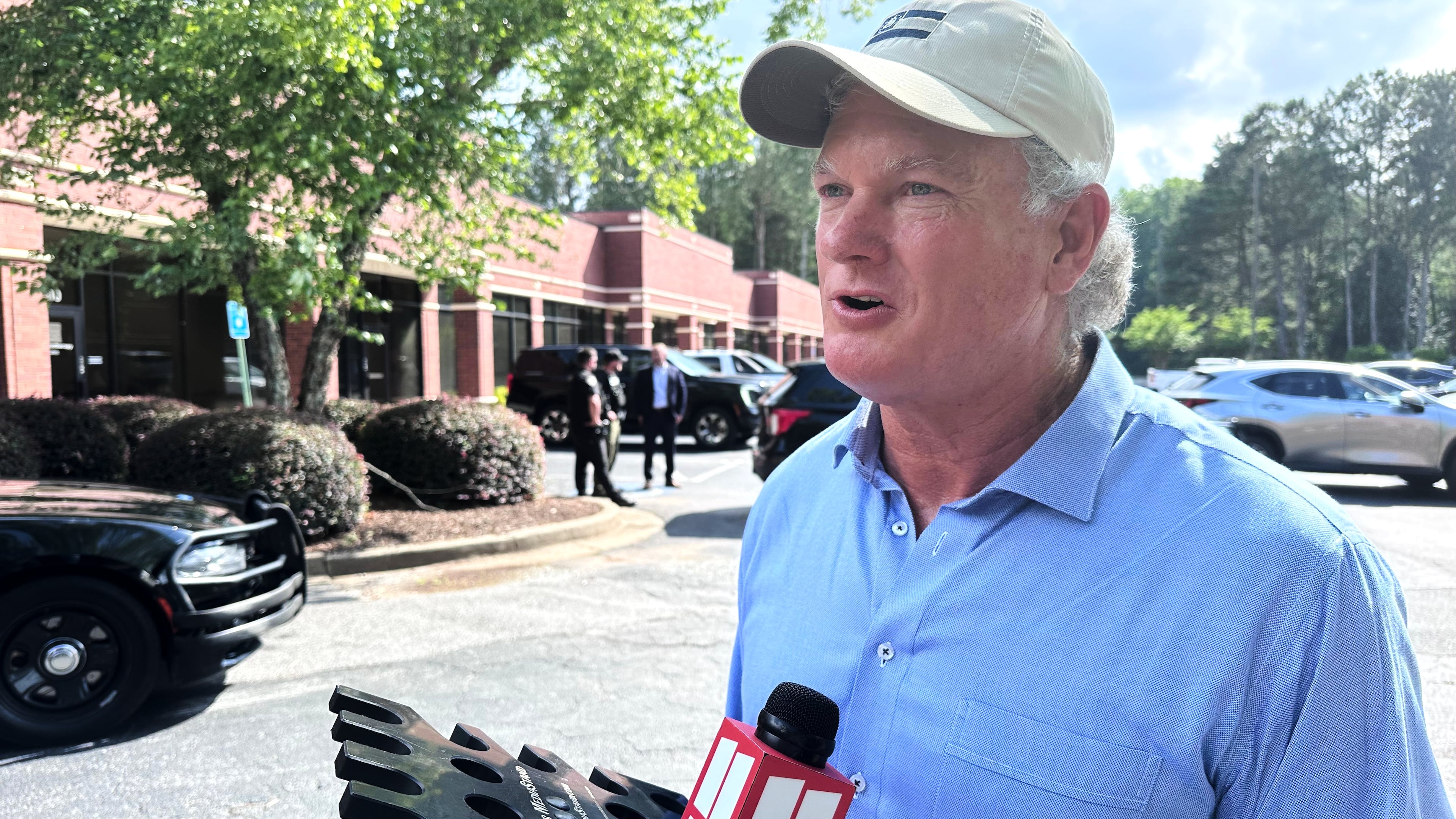 U.S. Rep Mike Collins campaigns in Woodstock, Ga., Sunday, June 14, 2026. ( AP Photo/Bill Barrow)