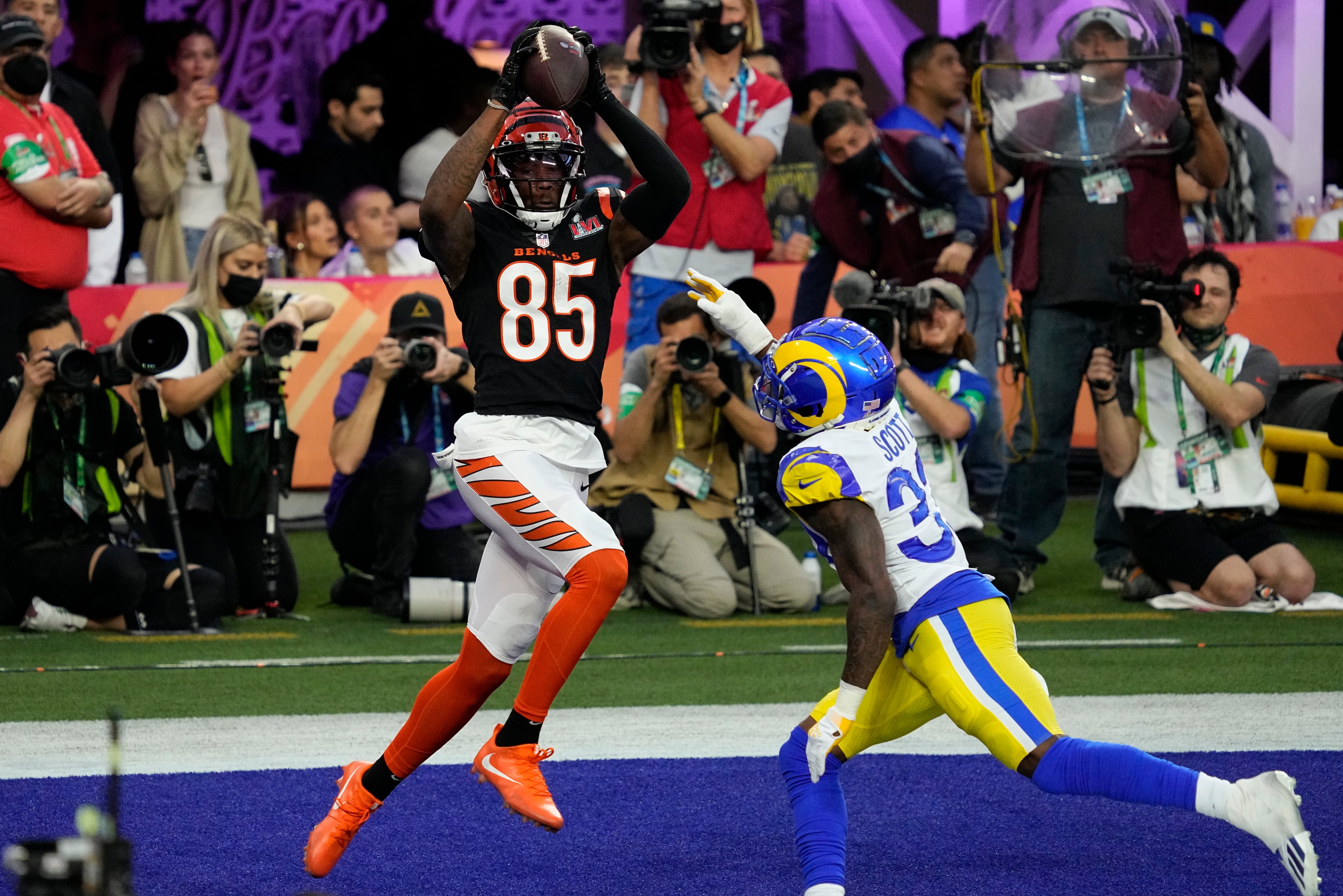 Cincinnati Bengals wide receiver Tee Higgins (85) pulls in a touchdown pass as Los Angeles Rams safety Nick Scott (33) defends during the first half of the NFL Super Bowl 56 football game Sunday, Feb. 13, 2022, in Inglewood, Calif. (AP Photo/Julio Cortez)