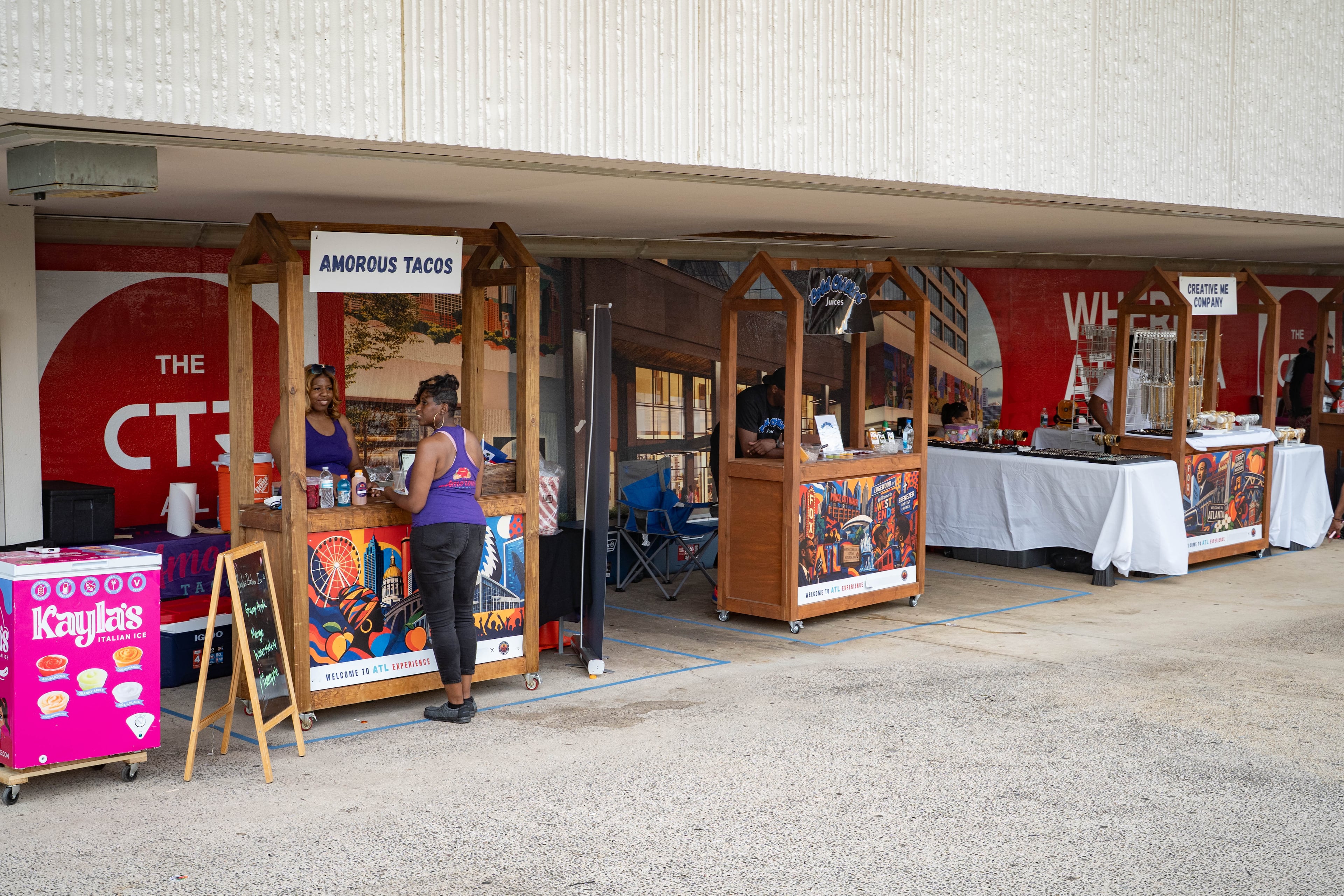 Multiple vendor booths are set up outside The Center in downtown Atlanta on June 24, 2026. (Ben Hendren for the AJC)