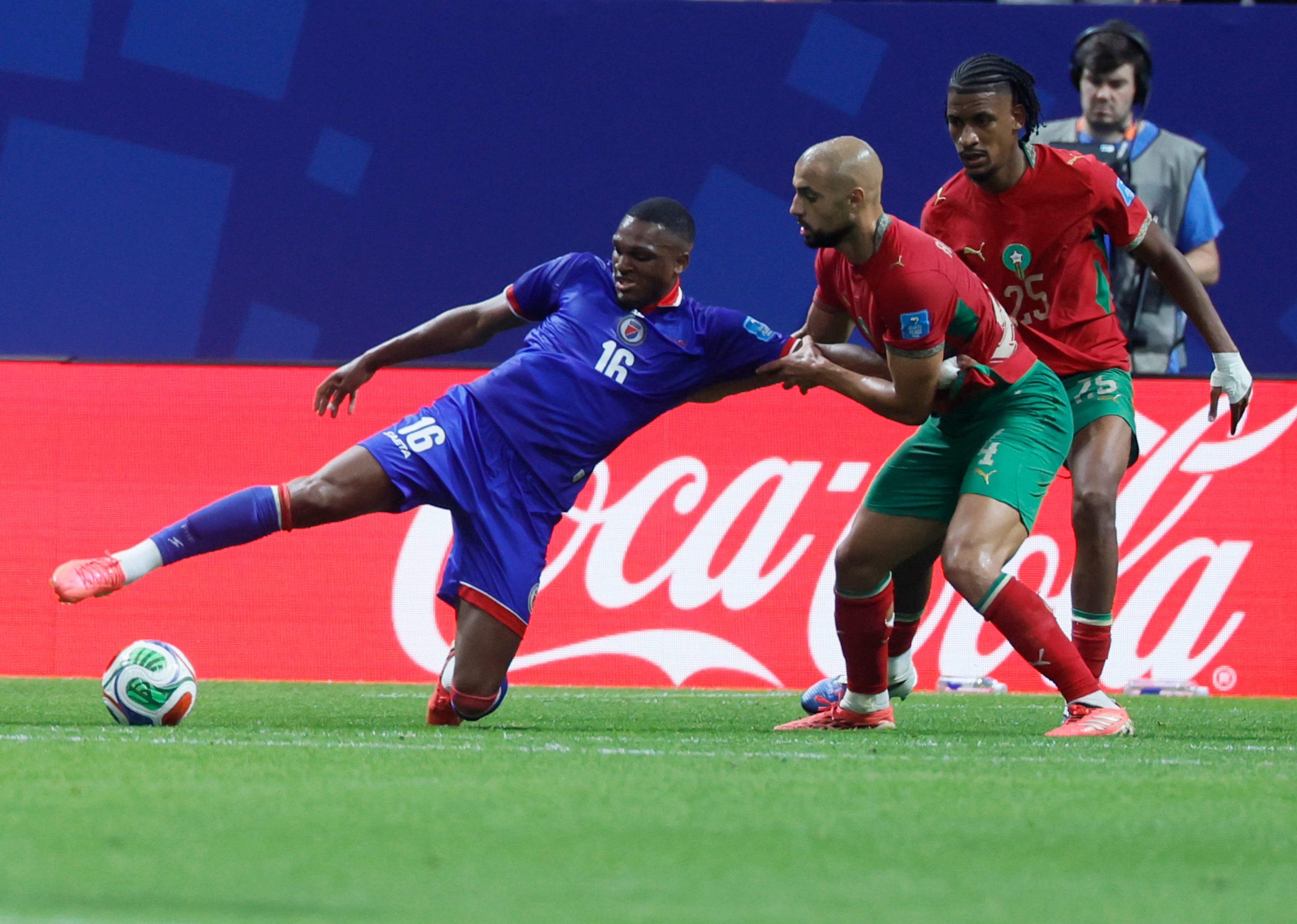 Haiti's Lenny Joseph is grabbed by Morocco's Sofyan Amrabat during first half of Morocco vs. Haiti Group C FIFA World Cup match at Atlanta Stadium (Mercedes-Benz Stadium) on Wednesday, June 24, 2026. (Miguel Martinez/AJC)