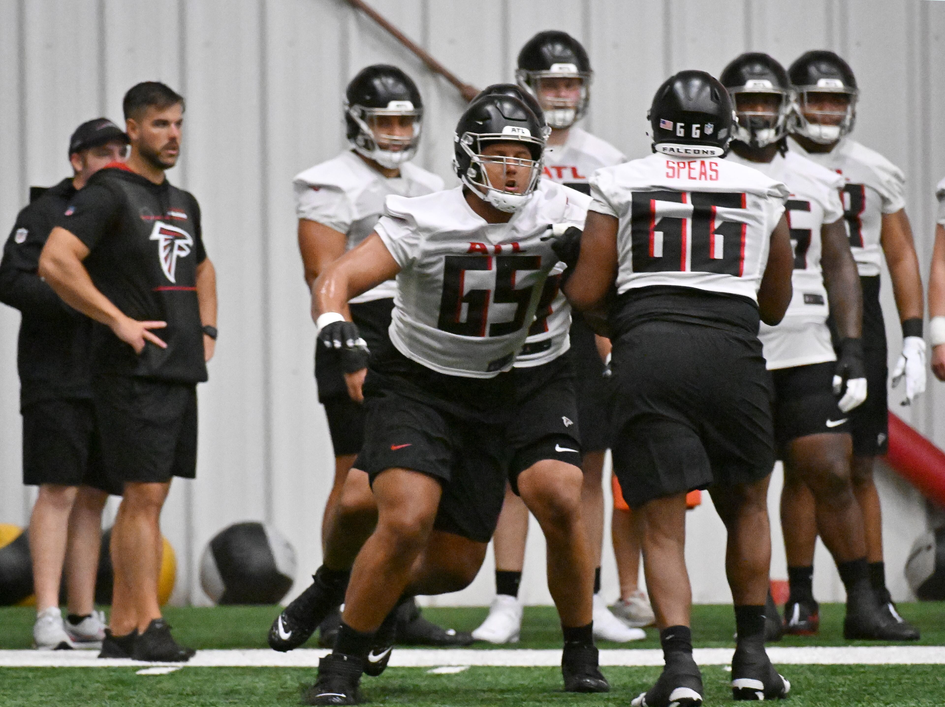 Guard Matthew Bergeron (65) and tackle Bryson Speas (66) participate in a drill during rookie minicamp at Atlanta Falcons Training Facility, Friday, May 12, 2023, in Flowery Branch. (Hyosub Shin / Hyosub.Shin@ajc.com)