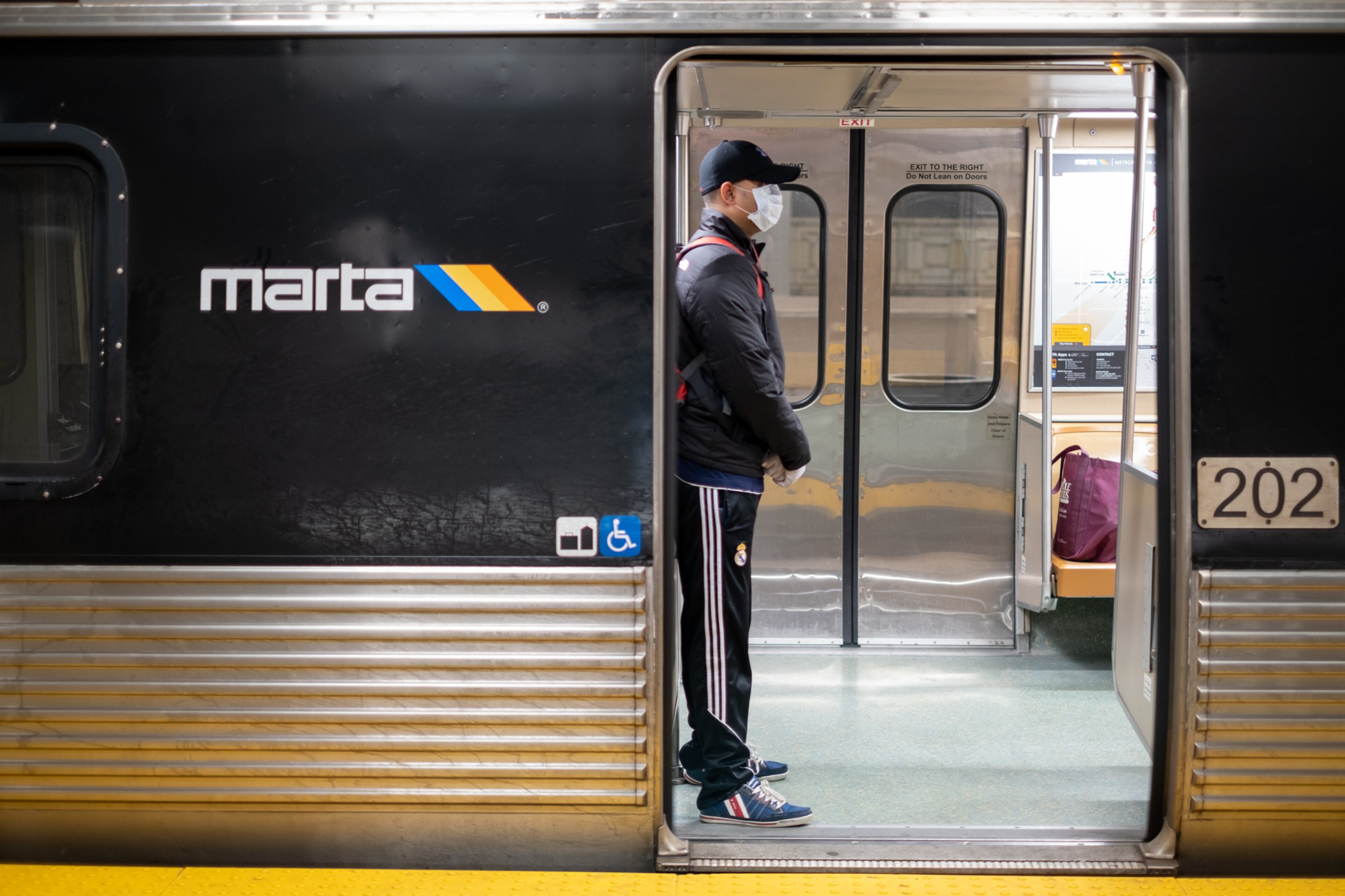 Ranjan Roy waits on a nearly empty train at the Five Points MARTA station during rush hour Friday morning March 20, 2020 while waiting for a train to take him to his work at Georgia State University. Roy said he normally has to arrive 15 minutes earlier because of the crowds at the station. Ben@BenGray.com for the Atlanta Journal-Constitution