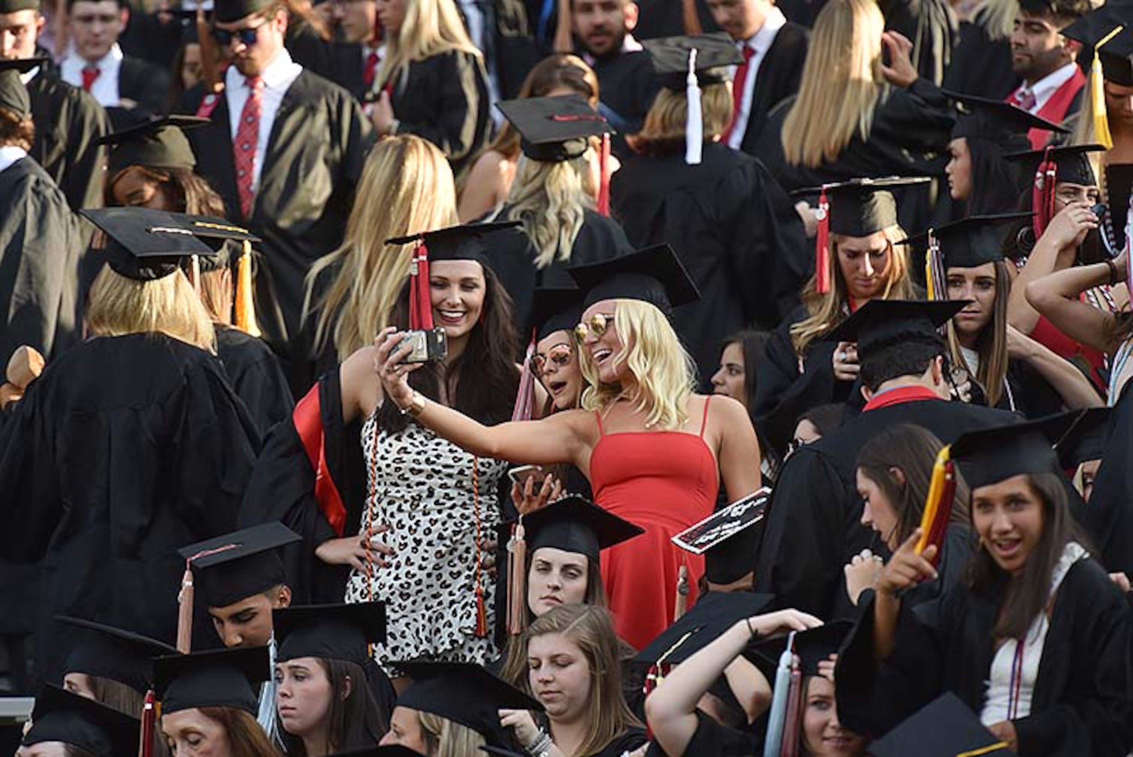 May 10, 2019 Athens - University of Georgia students take their selfies before 2019 spring undergraduate commencement ceremony at Sanford Stadium in Athens on Friday, May 10, 2019. HYOSUB SHIN / HSHIN@AJC.COM