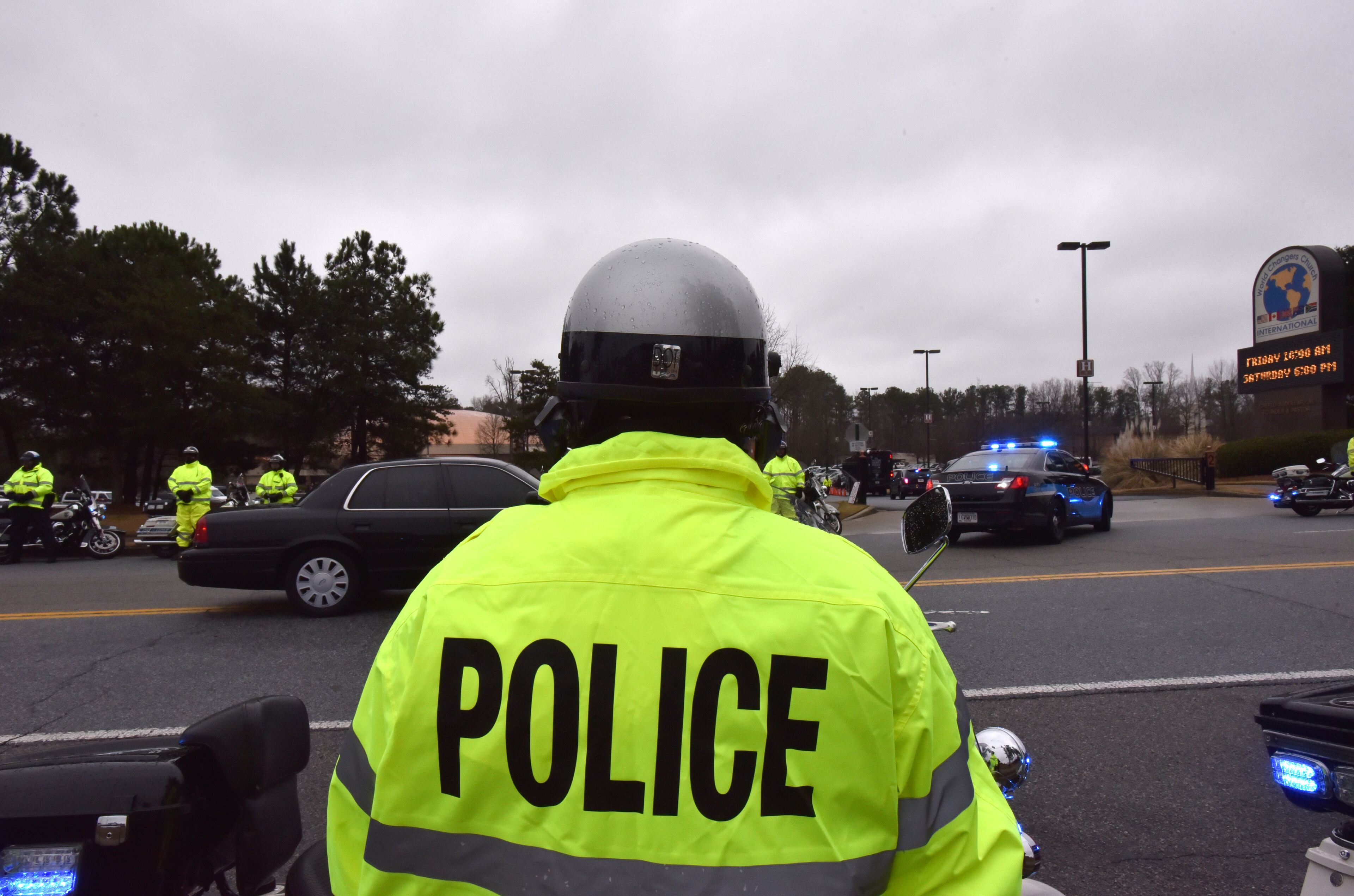 Law enforcement procession arrives at World Changers International Church to honor and attend the funeral of Fulton County Detective Terence Green, who was killed in an ambush, on Friday, March 13, 2015. Terence Avery Green, 48, was on duty March 4 when he was killed in what a Fulton police assistant chief called an ambush-style attack. HYOSUB SHIN / HSHIN@AJC.COM