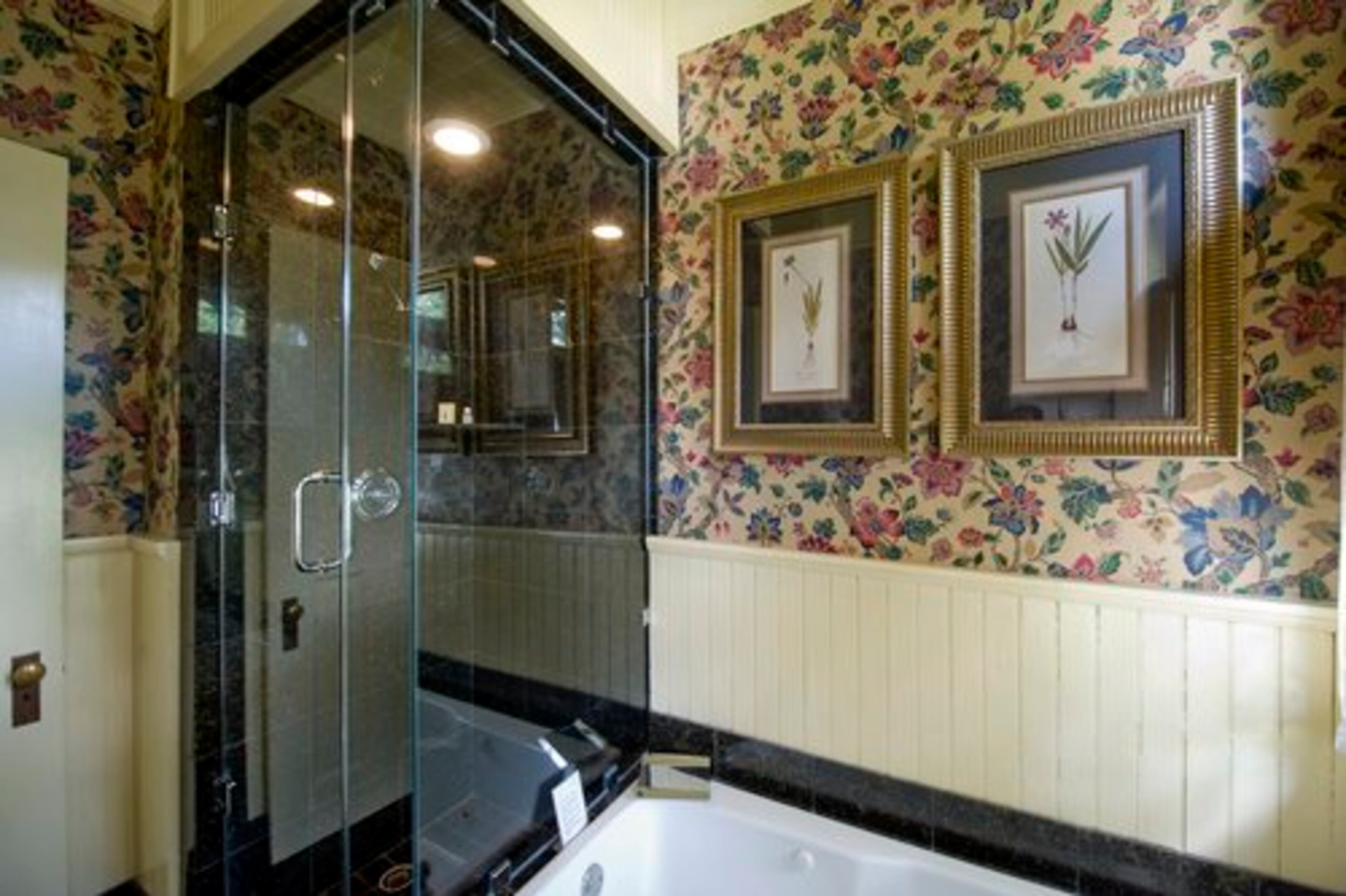 The bath in the Veranda room. Maintaining a 127-year-old home is an ongoing project. Ed says there's always work being done on the property on any given day. Bathrooms, for example, come in for periodic upgrades to keep up with the demand for luxurious spaces.