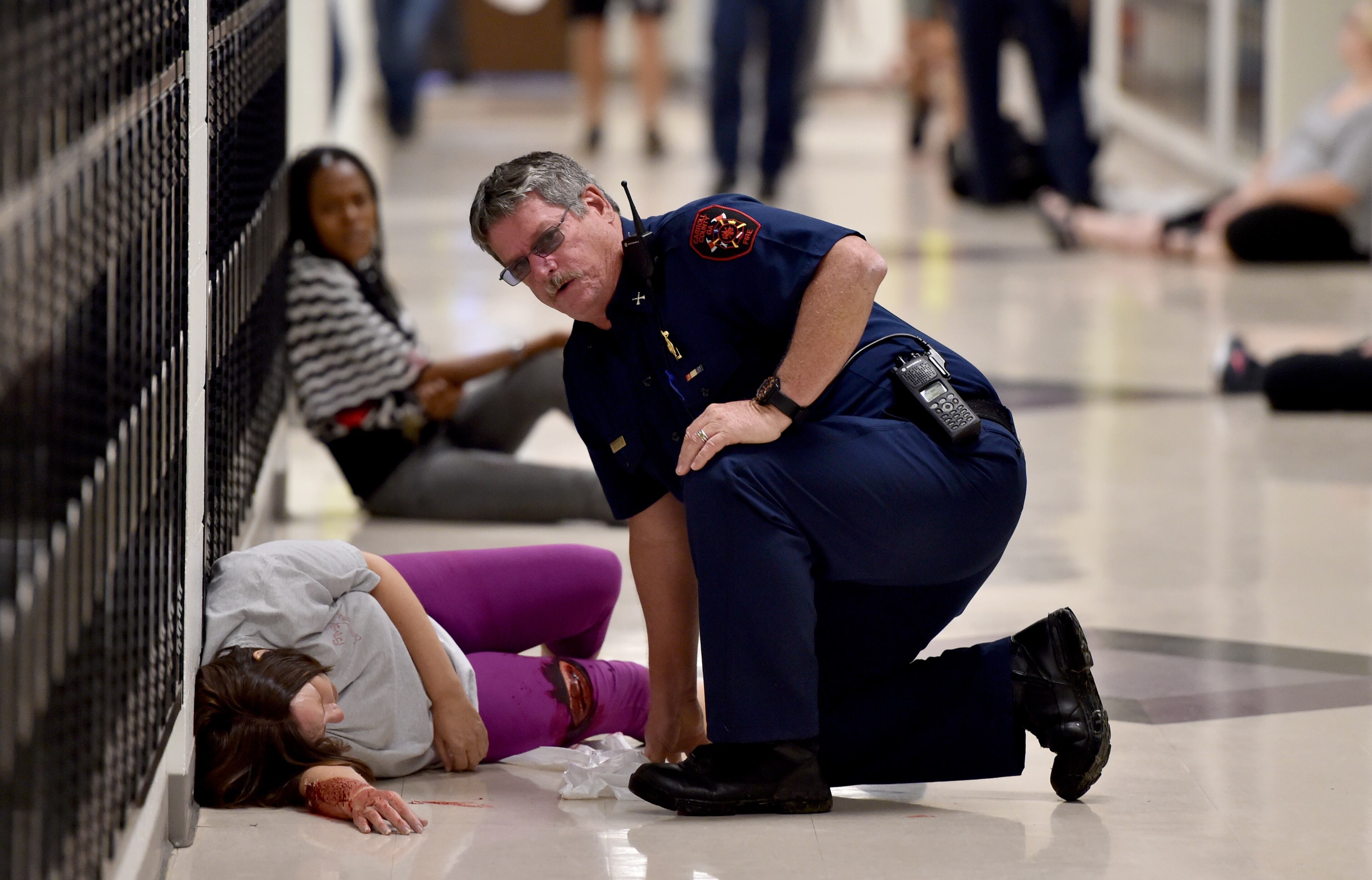 October 9, 2015 Villa Rica, GA: An active shooter drill took place at Villa Rica High School Friday October 9, 2015. Carroll County School, Villa Rica Police Department, Carroll County Public Safety, Georgia State Patrol and Tanner Healthcare took part in the drill. School was not in session, teachers and administrators played the part of students during the drill. A shooter played by a law enforcement officer entered the school and began shooting. The drill was designed to test the response of school officials, police and EMT. "Patients" were transported to the hospital via ambulances and helicopter. Officials said drills are important tools to help reinforce disaster preparedness and give the faculty the skills they need to respond in a real-world scenario. BRANT SANDERLIN/BSANDERLIN@AJC.COM