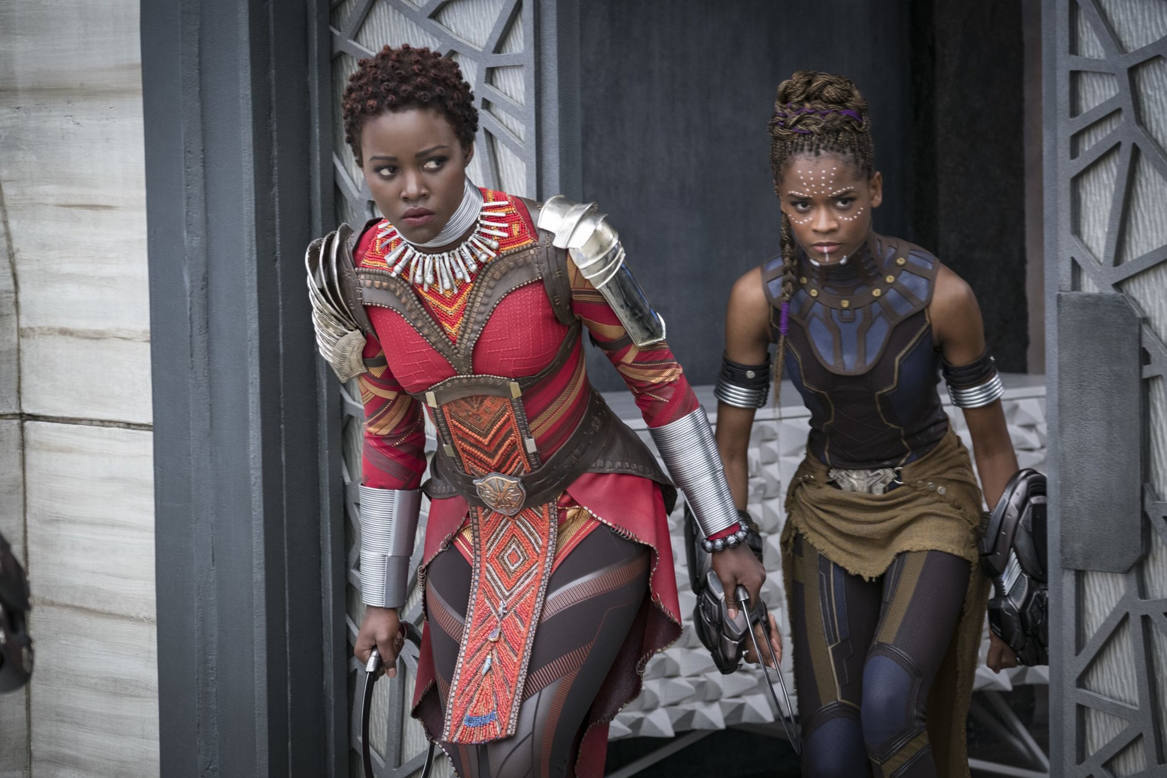 Lupita Nyong’o, left, and Letitia Wright in a scene from Marvel Studios’ “Black Panther.” The movie is breaking records with box office receipts. Matt Kennedy/Marvel Studios-Disney