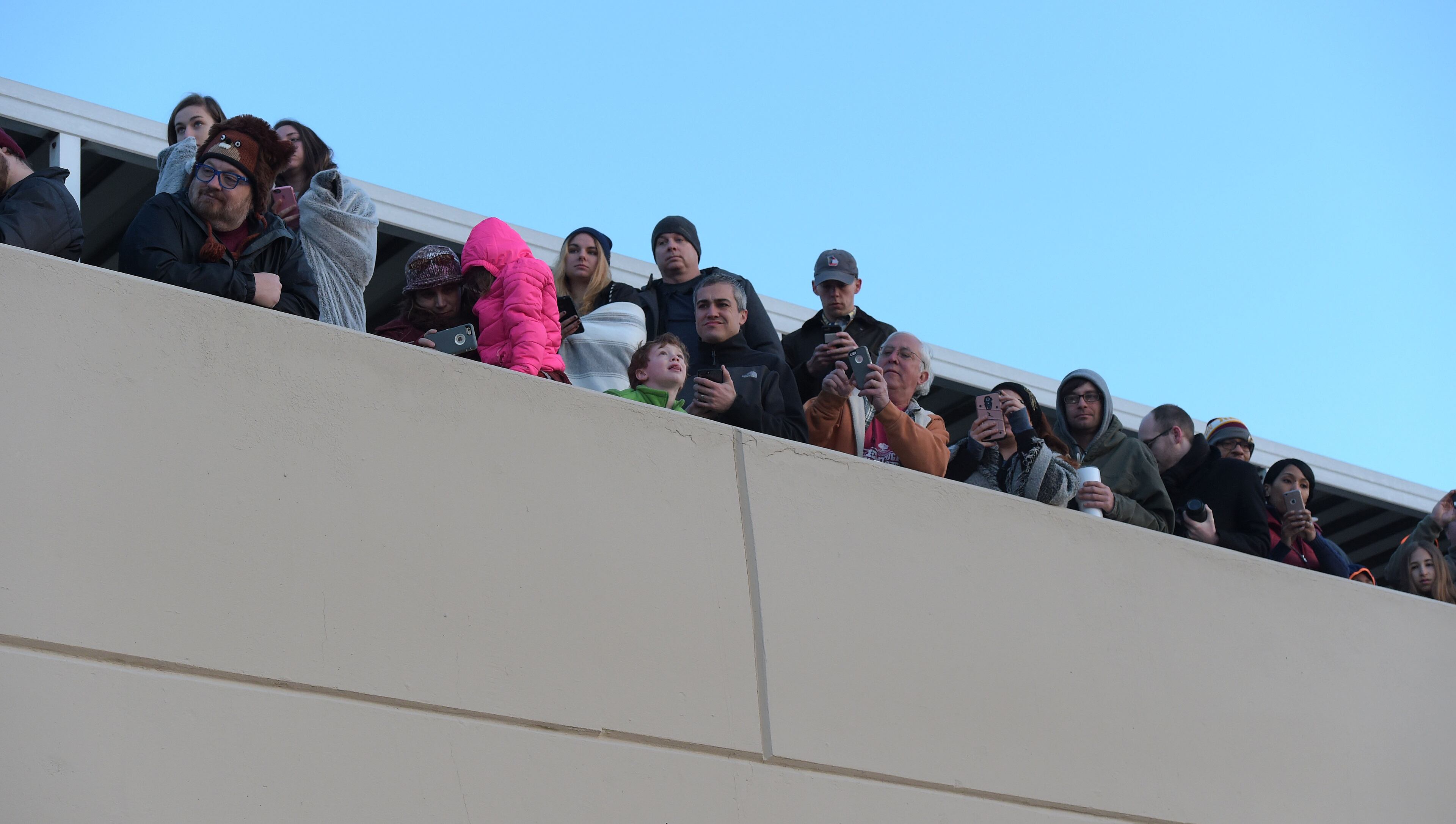 MARCH 5, 2017 7:00:49 AM ATLANTA Spectators watch as demolition crews bring down the old state archives building in a controlled implosion shortly after 7 am Sunday, March 5, 2017. The 14 story state archives building was about 50 years old and was imploded to make way for a new state courts building. Gov. Deal has budgeted about $105 million in next year's budget for the new state courts building. Kent D. Johnson/AJC