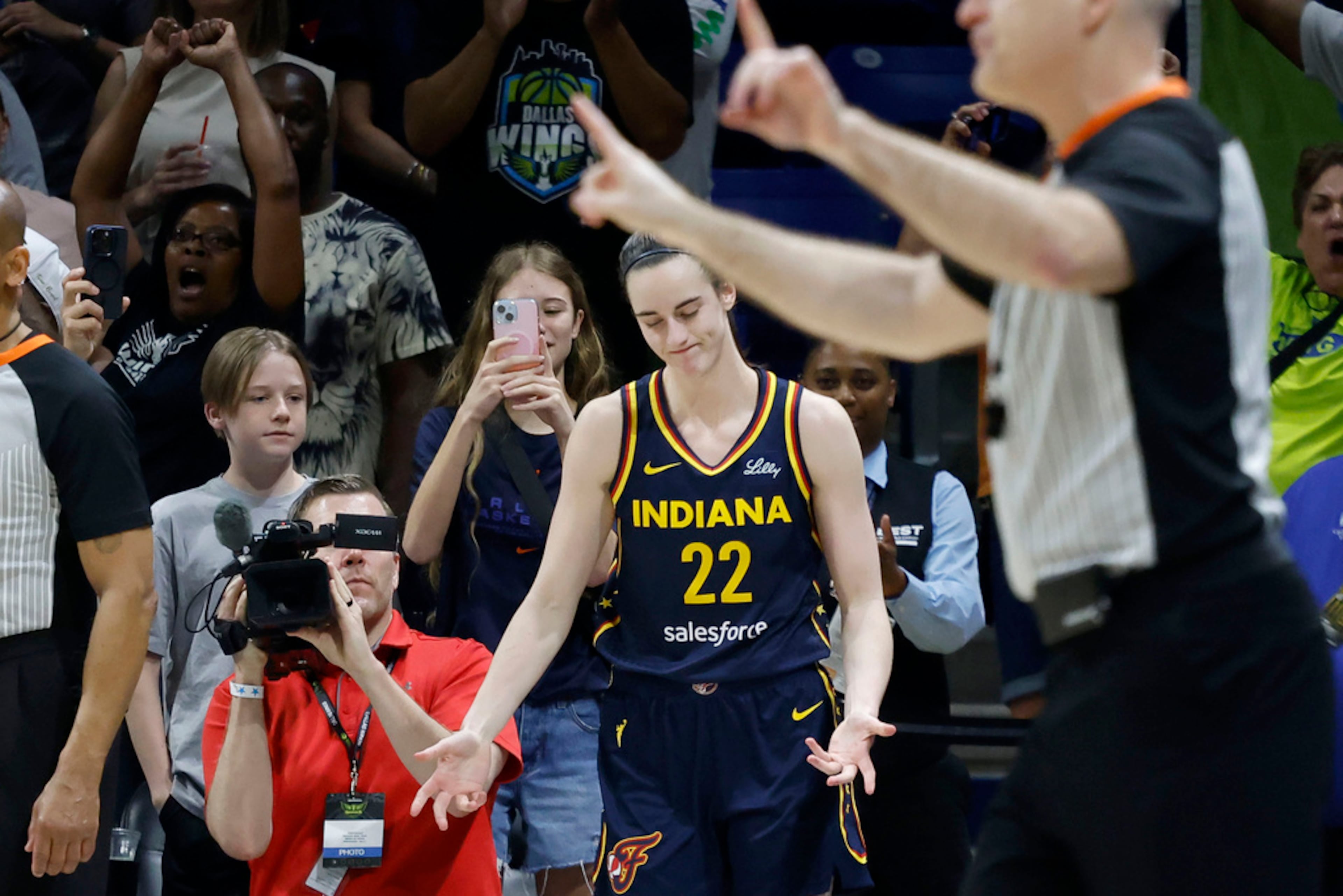 Indiana Fever guard Caitlin Clark (22) reacts after missing a three-point shot as they lost to the Dallas Wings during an WNBA basketball game in Arlington, Texas, Friday, May 3, 2024. (AP Photo/Michael Ainsworth)