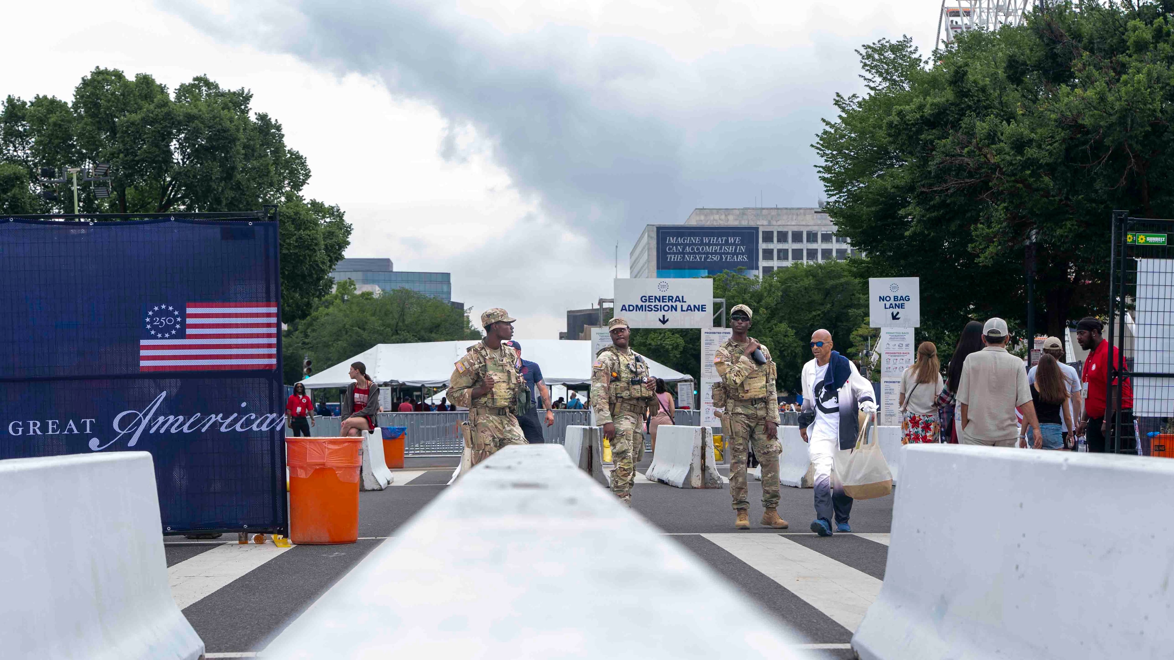 National Guard members stand at the entrance of the Great American State Fair on the National Mall, Saturday June 27, 2026, in Washington. (AP Photo/Jen Golbeck)
