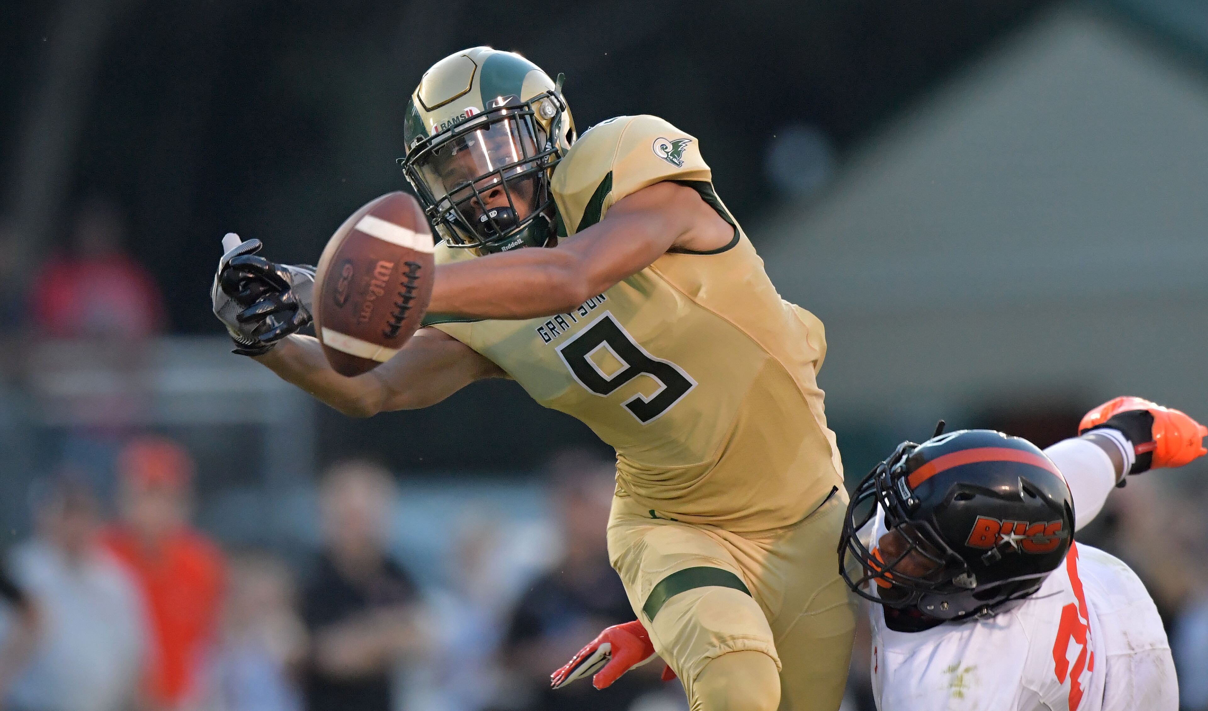 Grayson's Kenyon Jackson (9) is not able to catch the ball as Hoover's Tyrell Goldsmith (26) is trying to stop in the first half of Grayson vs Hoover (Alabama) at Grayson High School in Loganville on Friday, August 25, 2017. HYOSUB SHIN / HSHIN@AJC.COM