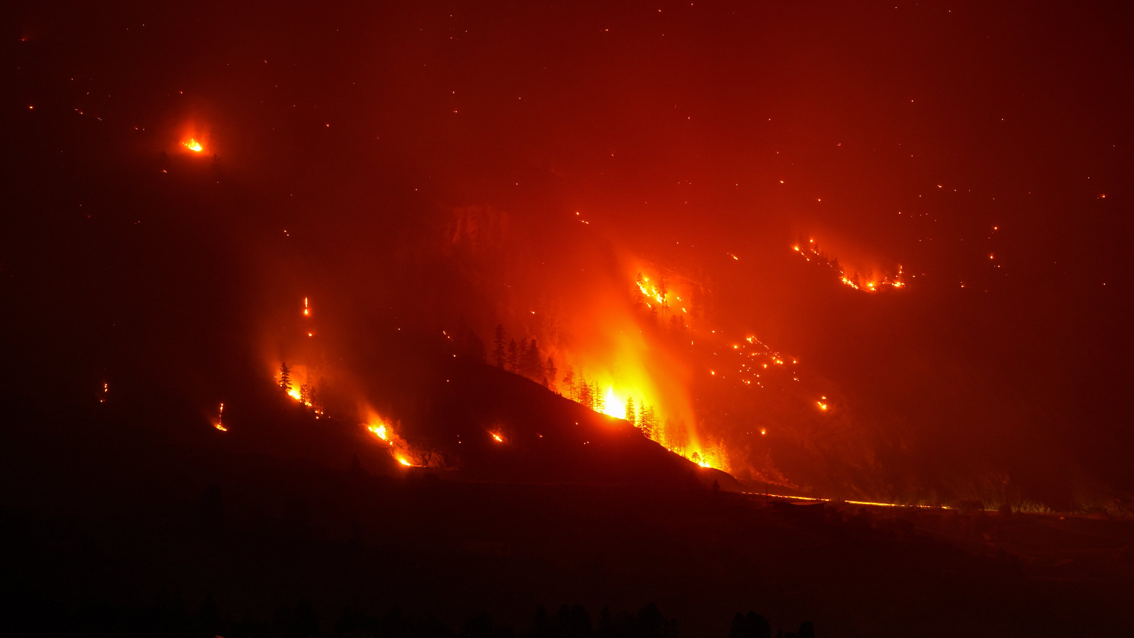 The Bald Range wildfire, that has forced people out of their homes in the south Okanagan region, burns in Summerland, B.C., late Saturday, Aug. 8, 2026. (Darryl Dyck/The Canadian Press via AP)