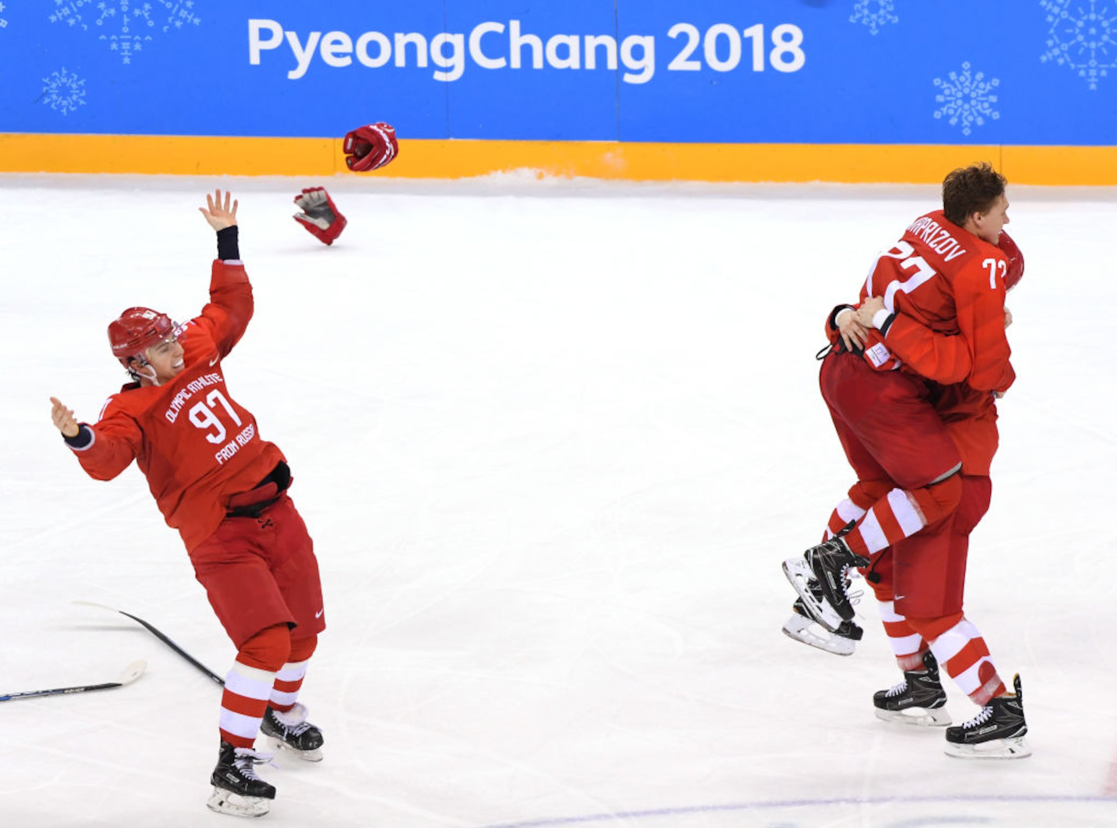 GANGNEUNG, SOUTH KOREA - FEBRUARY 25: Gold medal winner Kirill Kaprizov #77 of Olympic Athlete from Russia celebrates with Vyacheslav Voinov #26 and Nikita Gusev #97 after scoring a goal in overtime to defeat Germany 4-3 during the Men's Gold Medal Game on day sixteen of the PyeongChang 2018 Winter Olympic Games at Gangneung Hockey Centre on February 25, 2018 in Gangneung, South Korea. (Photo by Harry How/Getty Images)