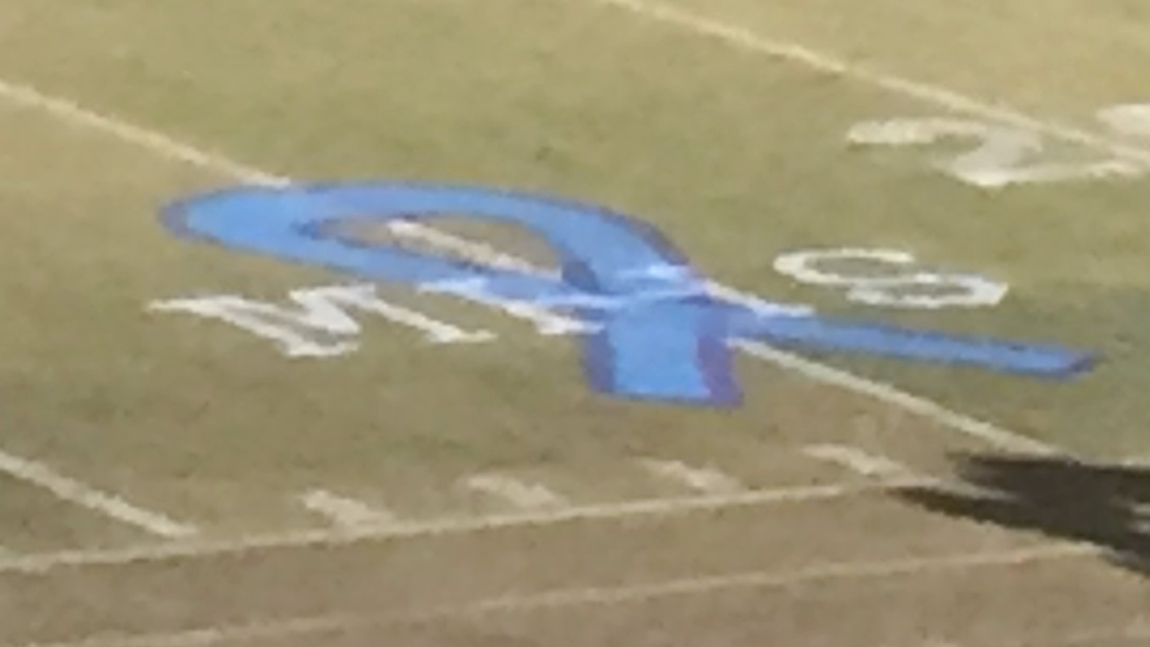 Painted on the 25-yard line at Norcross' Blue Devil Stadium was a blue ribbon with the letters "MHS" to honor the four Meadowcreek students involved in a tragic car crash on Oct. 27. Norcross hosted Meadowcreek for a high school football game on Friday. (photo credit Alex Makrides)