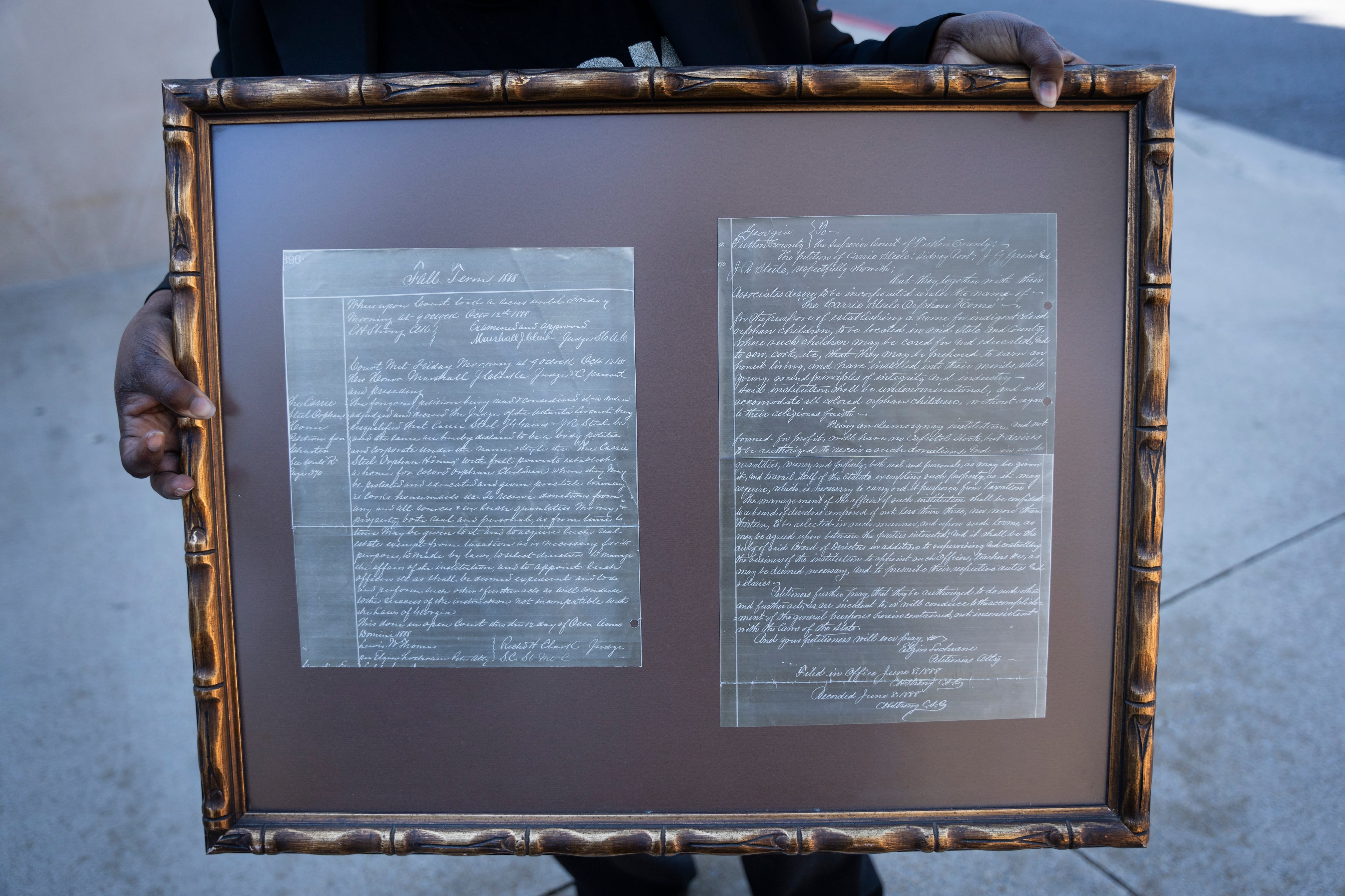 Director Eloise Mitchell holds original documents at the site of the old Carrie Steele-Pitts Home in Atlanta, Georgia on Monday, Feb, 3, 2025. (Olivia Bowdoin for the AJC).