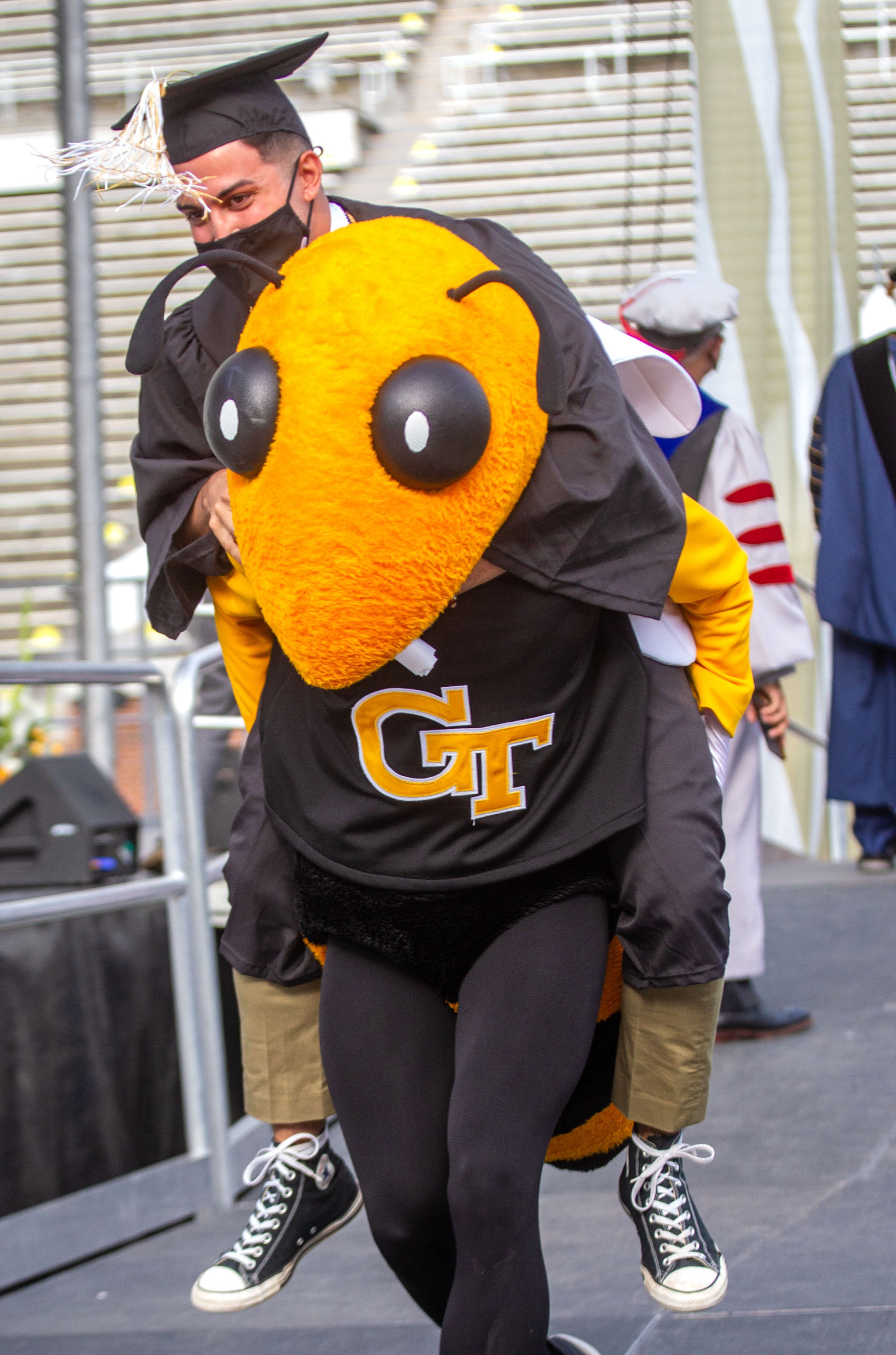 Georgia Tech mascot Buzz carries a graduate off the stage after he received his diploma during the Georgia Tech 2021 commencement ceremony on Saturday, May 8, 2021. Two ceremonies were held Saturday for bachelor’s degree recipients, and master's and doctoral graduates' ceremonies were held Friday. (Photo: Steve Schaefer for The Atlanta Journal-Constitution)