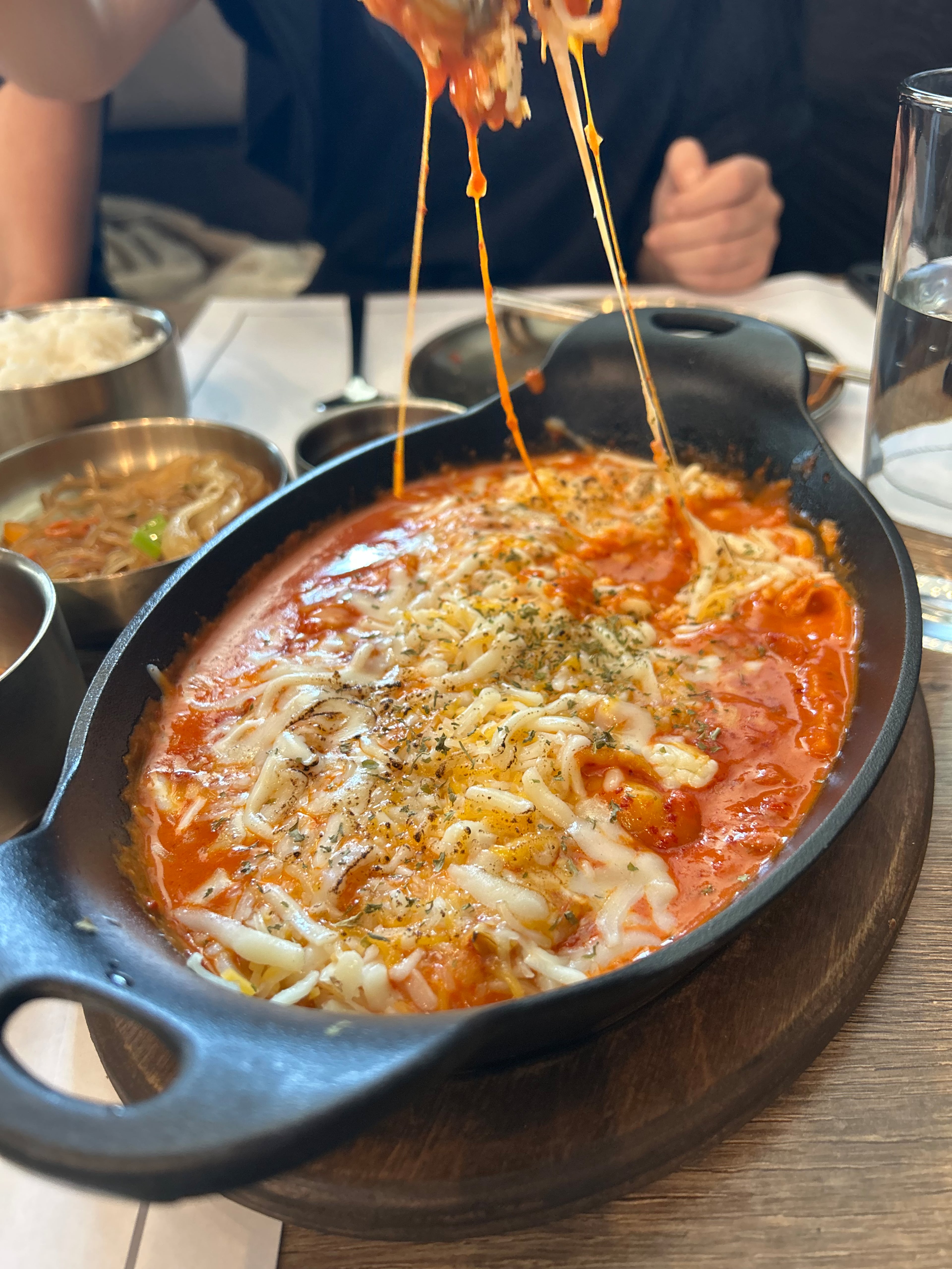 A dish of rose tteokbokki at Jang Su Jang in Alpharetta. (Candy Hom for the AJC)