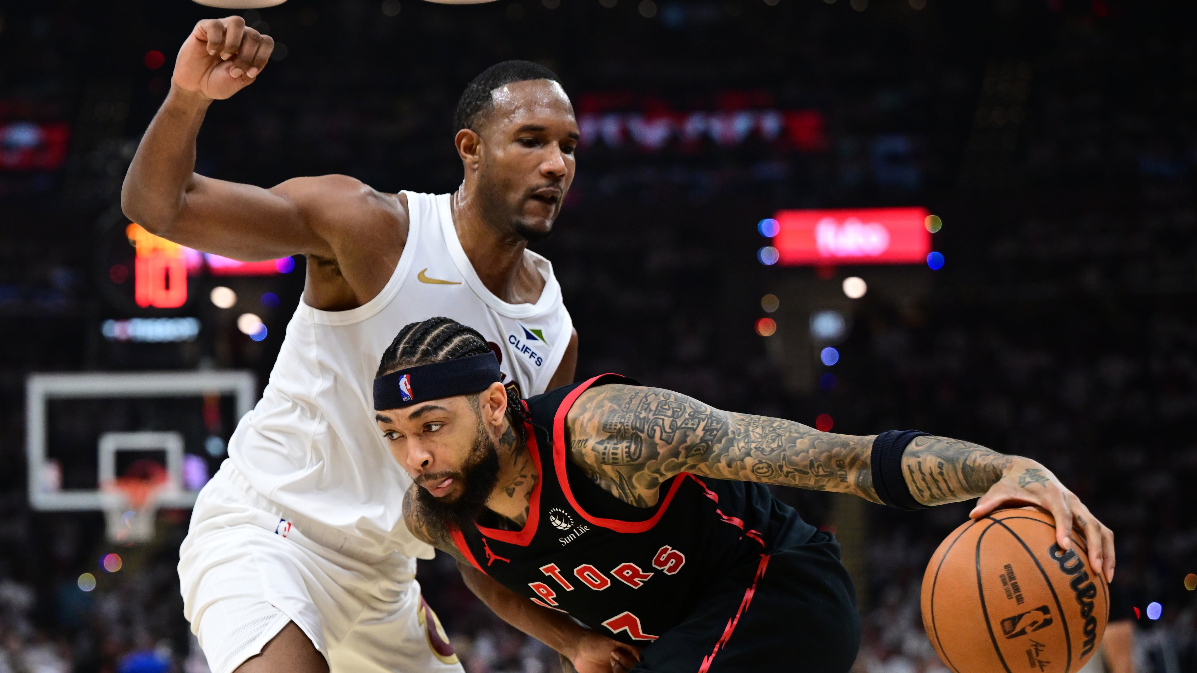 Toronto Raptors forward Brandon Ingram drives on Cleveland Cavaliers center Evan Mobley during the first half in Game 5 of a first-round NBA playoffs basketball series, Wednesday, April 29, 2026, In Cleveland. (AP Photo/David Dermer)