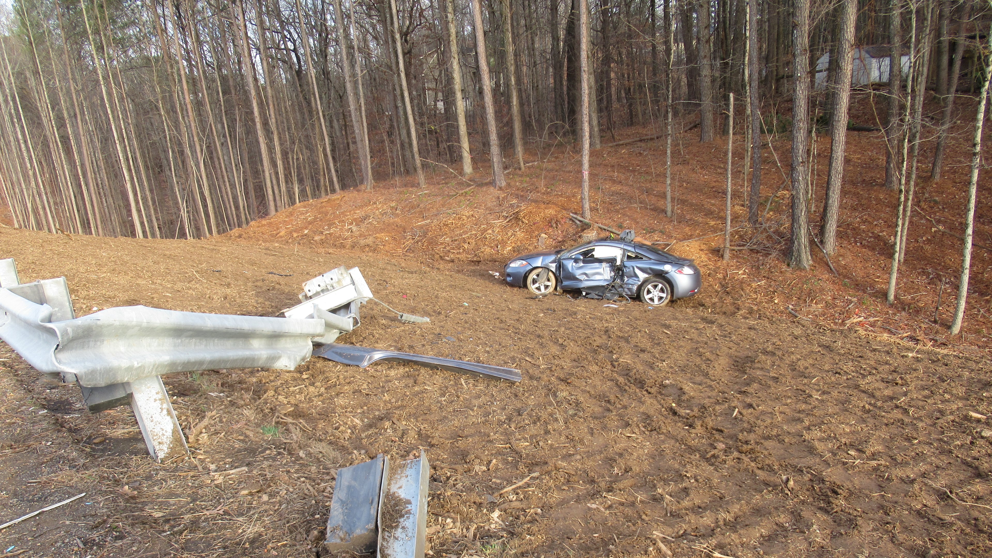 A woman died Wednesday after leaving the roadway and going down an embankment in a Mitsubishi Eclipse, according to police.