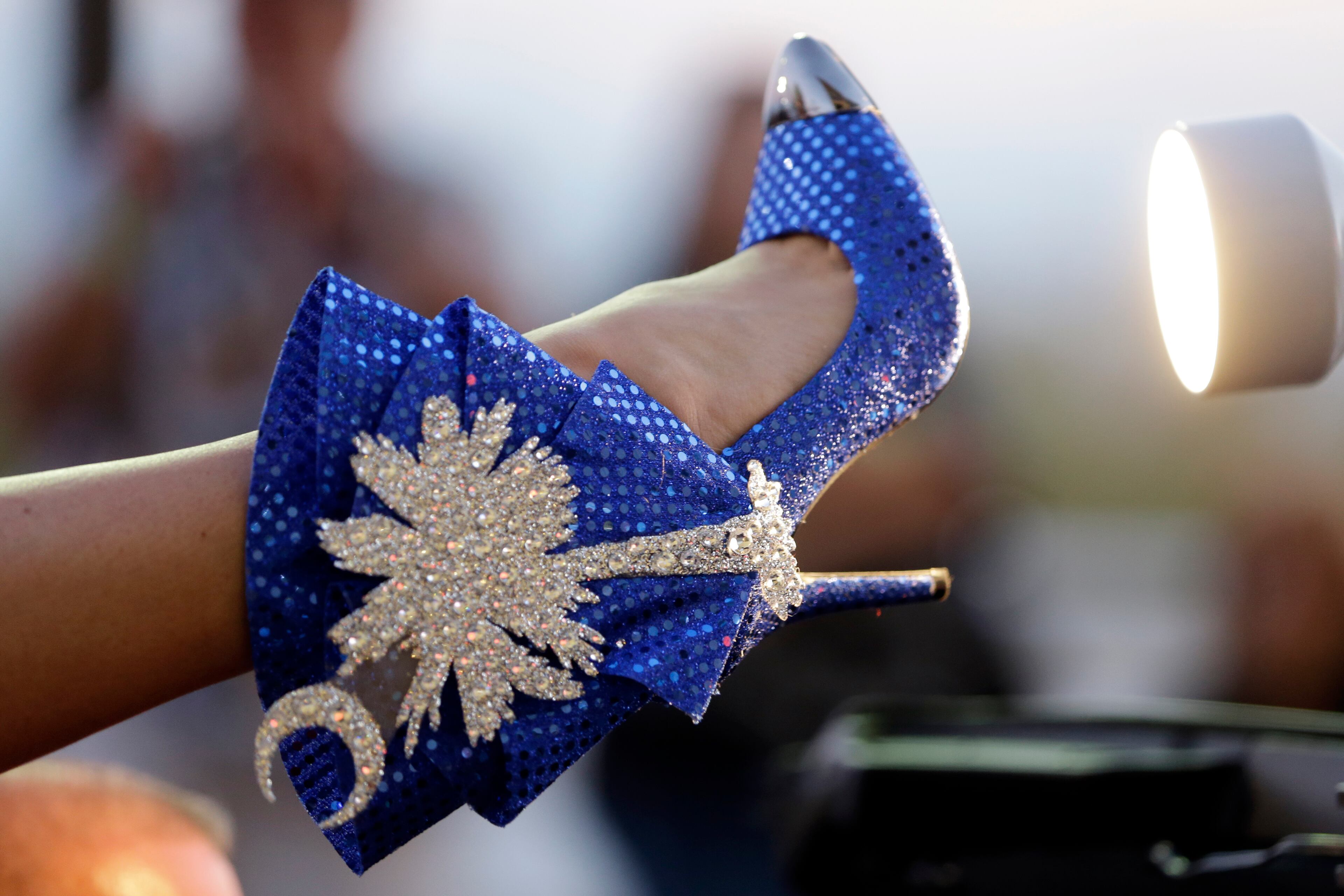 Miss South Carolina Brooke Mosteller displays her shoe during the Miss America Shoe Parade at the Atlantic City boardwalk, Saturday, Sept. 14, 2013, in Atlantic City, N.J.