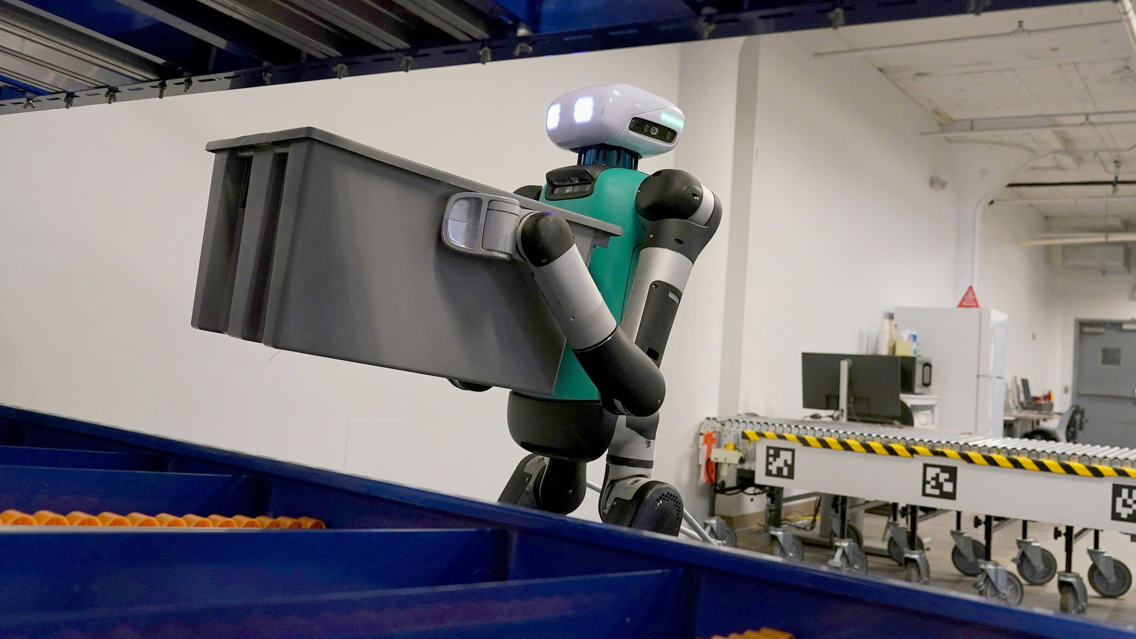 FILE - Agility Robotics' warehouse robot Digit performs maneuvers at the company's office in Pittsburgh on Aug. 16, 2023. (AP Photo/Matt Freed, File)
