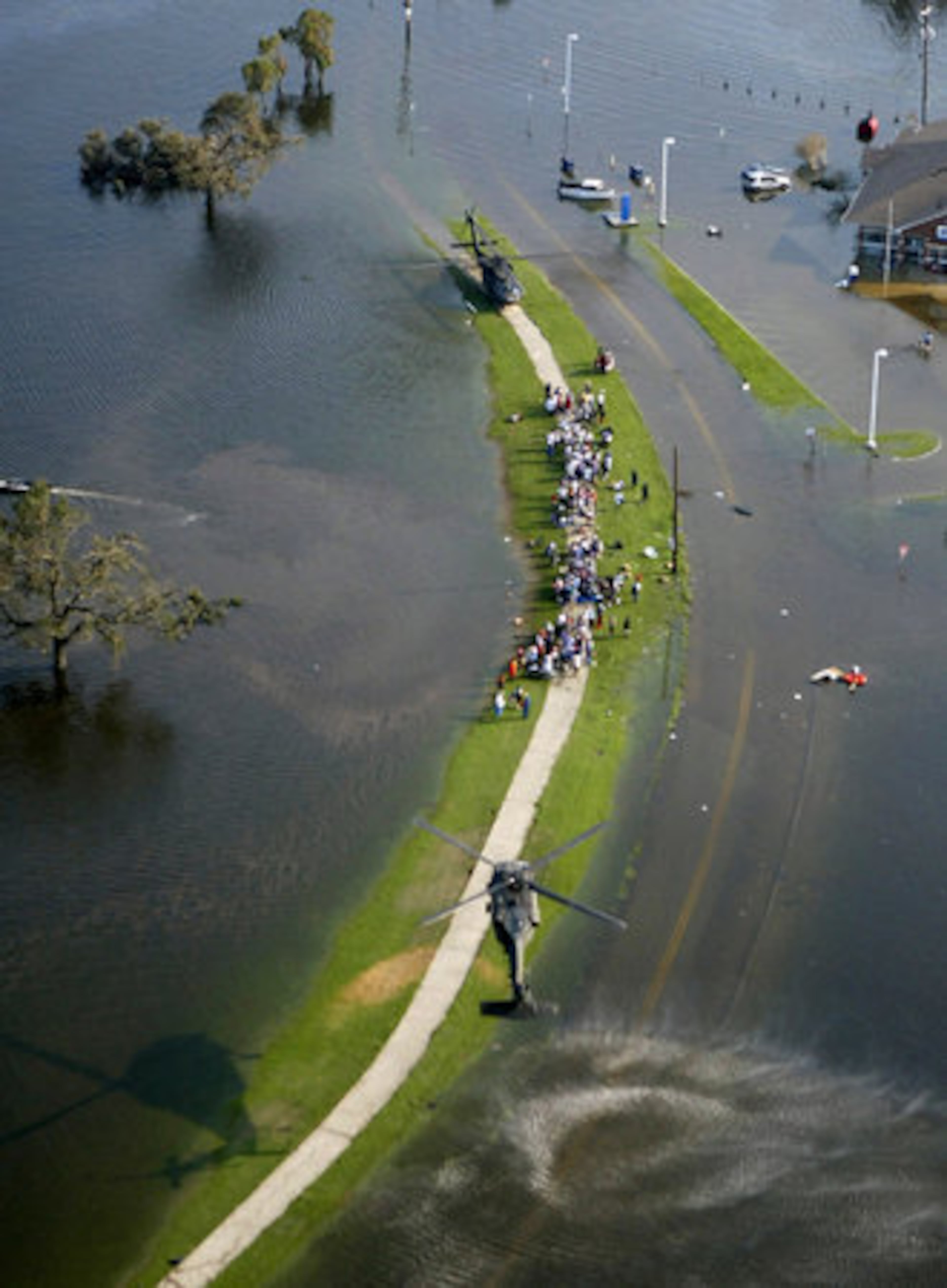 New Orleans residents are rescued by helicopter from the floodwaters of Hurricane Katrina Wednesday, Aug. 31, 2005 in New Orleans.