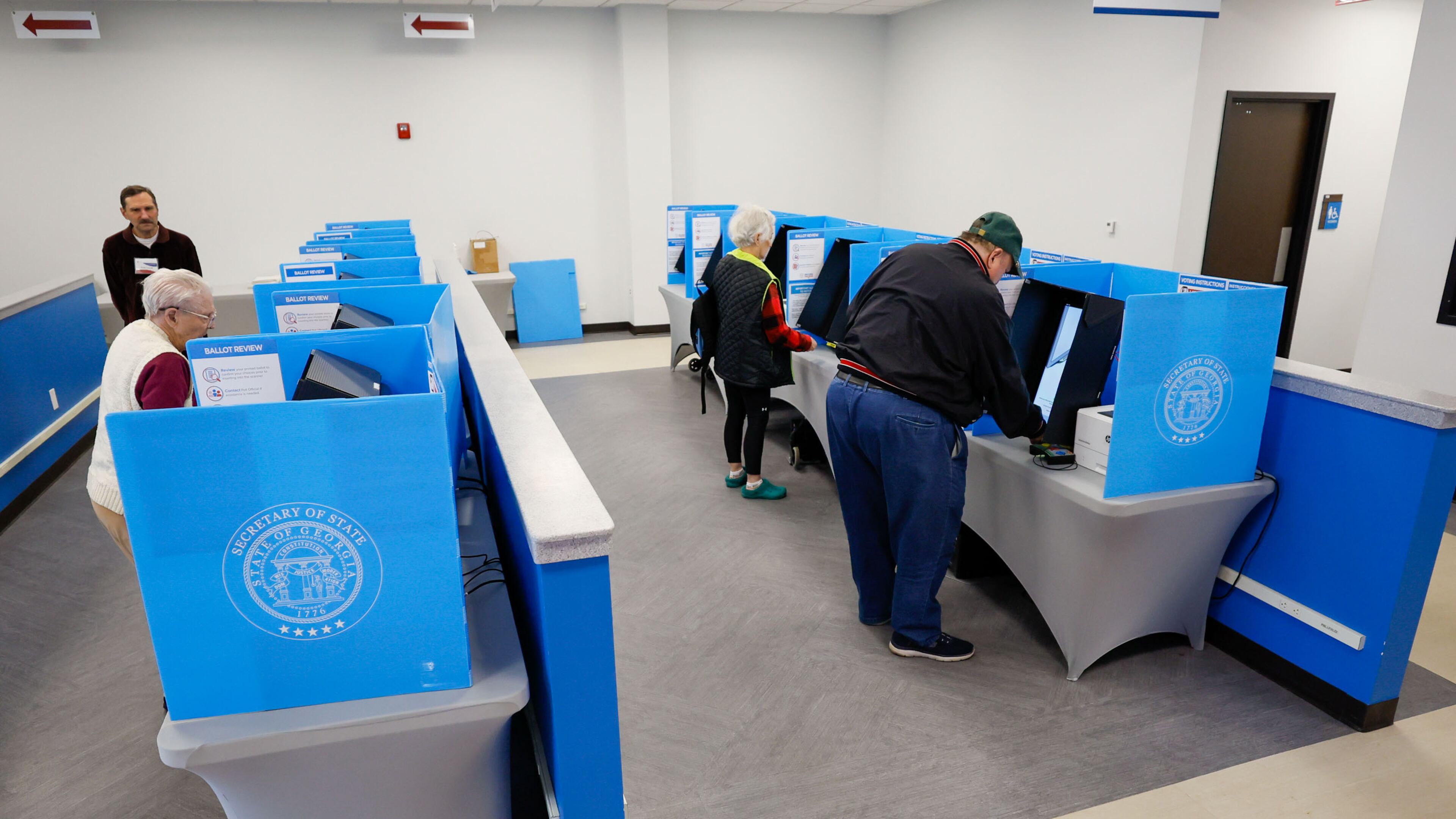 People cast their votes at the Gwinnett County Voter and Registration during early voting for the presidential primary in February. Voters will cast ballots Tuesday in Georgia's general primary, setting every race for November besides president. (Miguel Martinez / miguel.martinezjimenez@ajc.com)