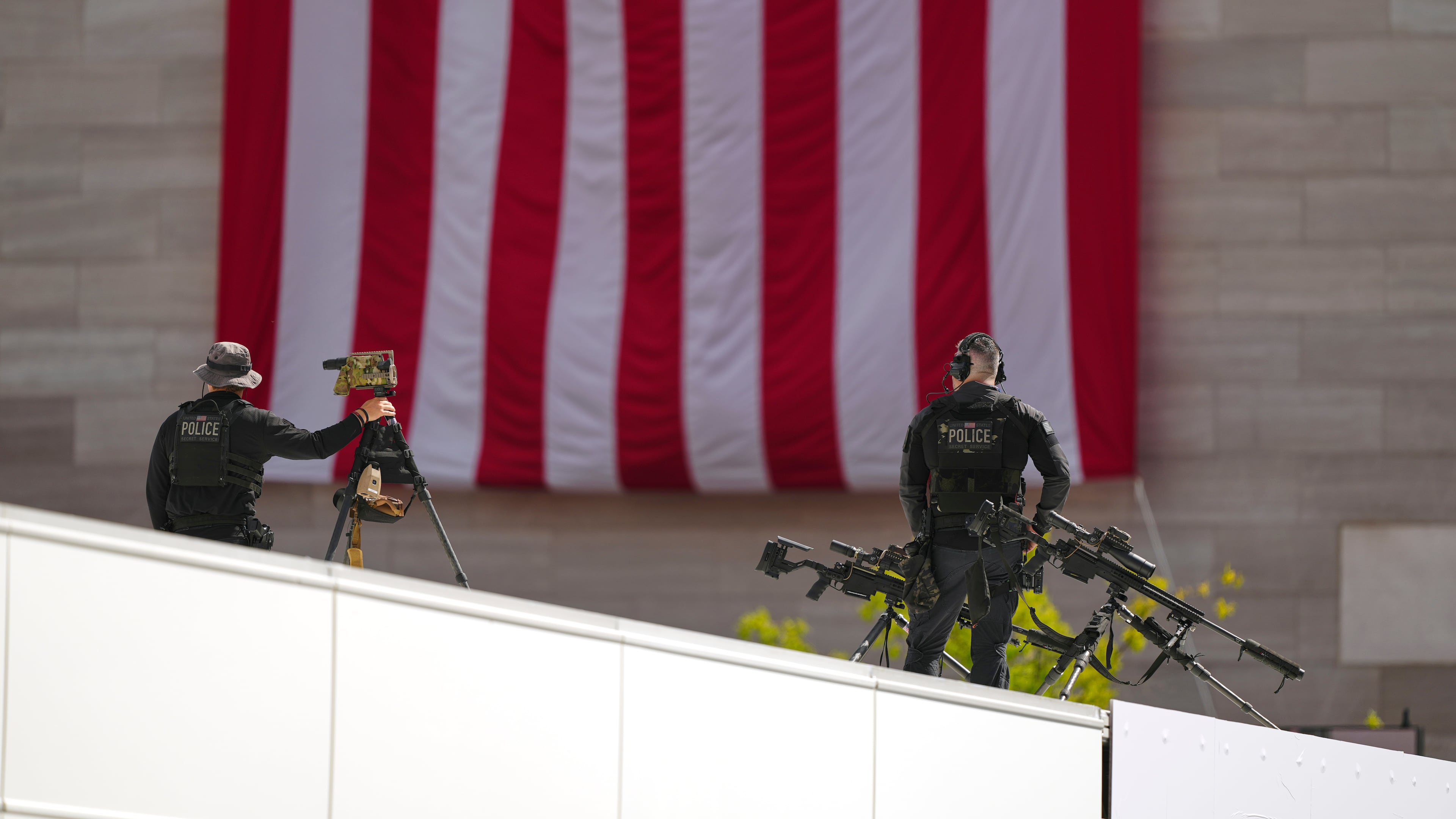 Members of the U.S. Secret Service police conduct overwatch during the IndyCar Freedom 250 Grand Prix auto race, Sunday, Aug. 23, 2026, in Washington. (AP Photo/Julia Demaree Nikhinson)